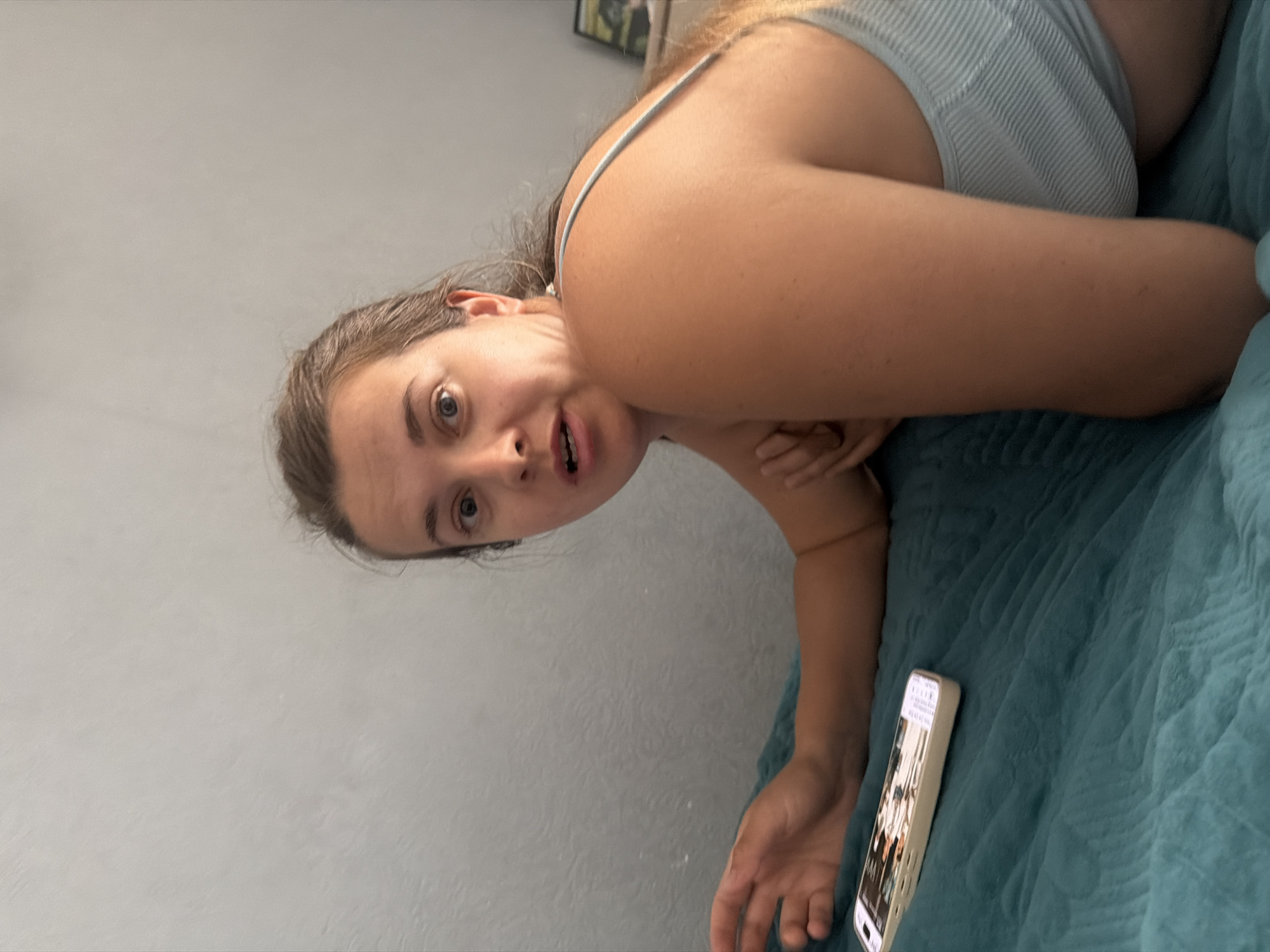 Quiet downtime on teal bedding in Sochi