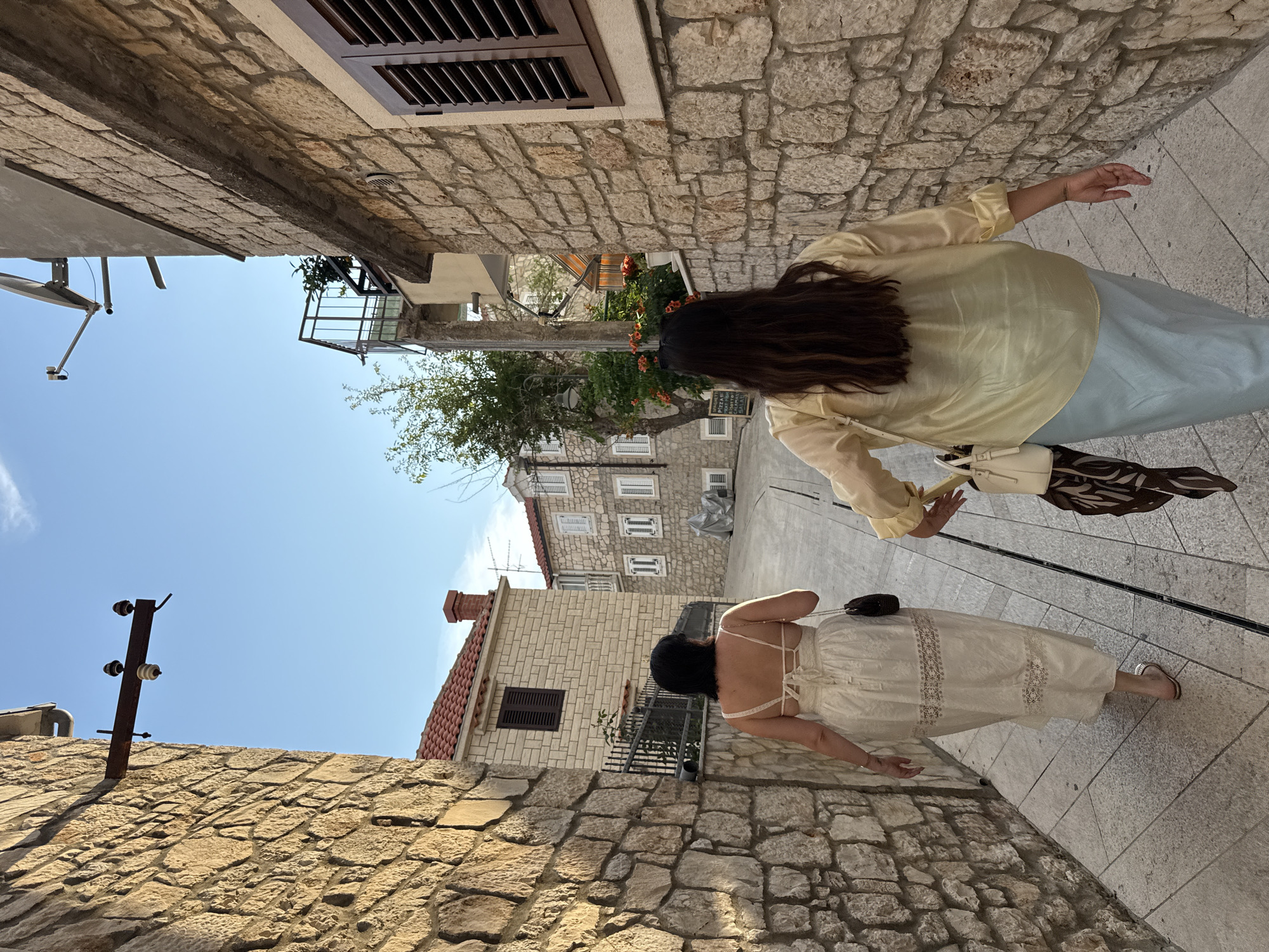 Afternoon wander through Primošten's old town, rainbow included