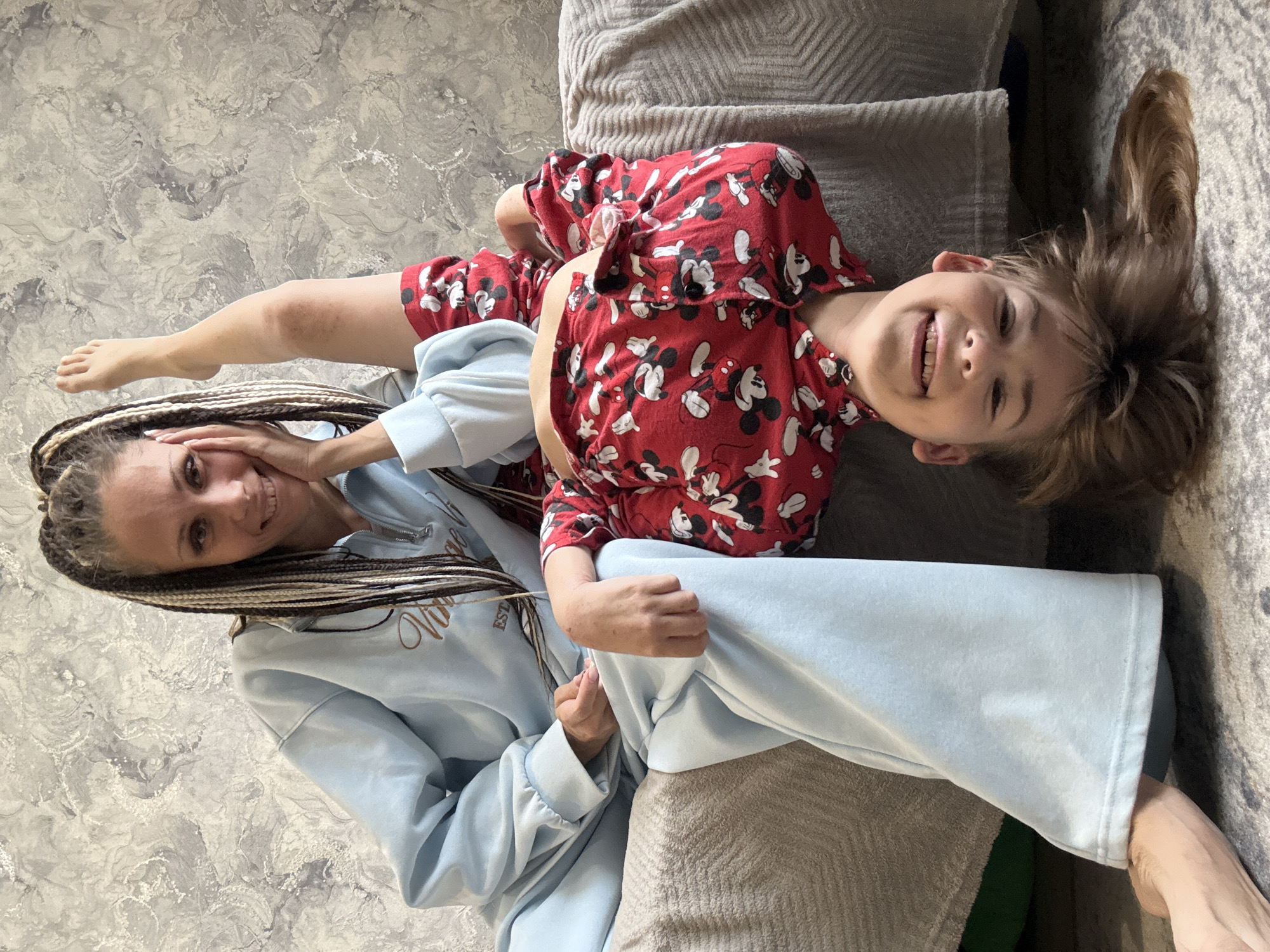 Mother and child photographed together on sofa in Rusanovo