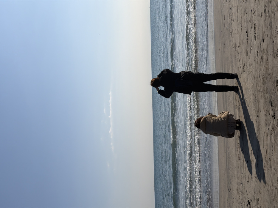 Two people observed at Kamakura beach during early morning hours