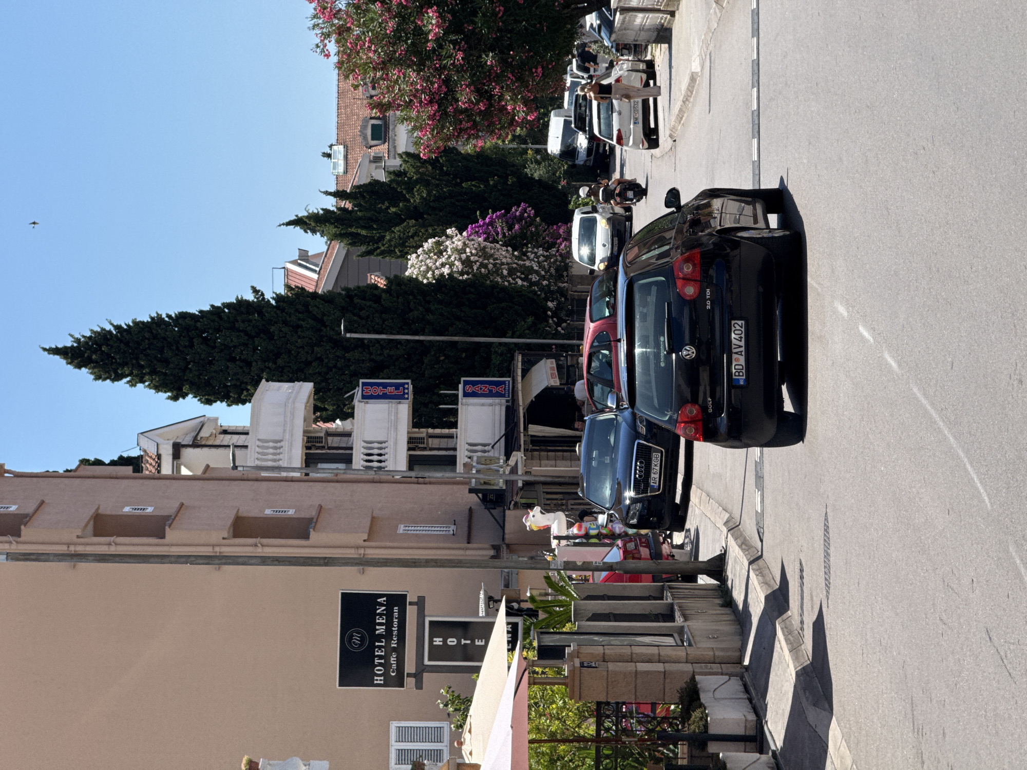 Sketching and coffee at a Budva street café, summer morning