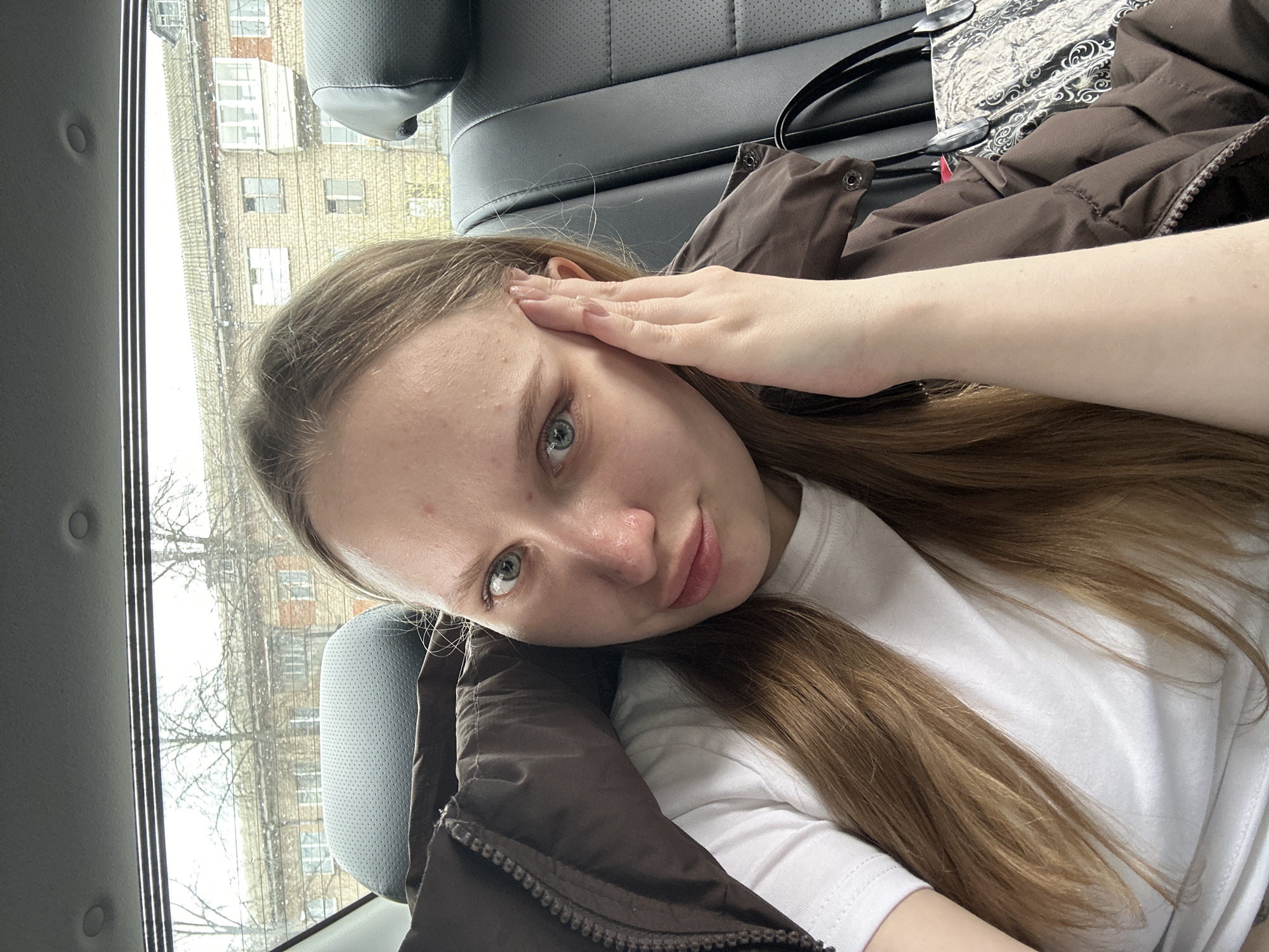 Woman takes rotated selfie in car in Chaikovsky, Russia