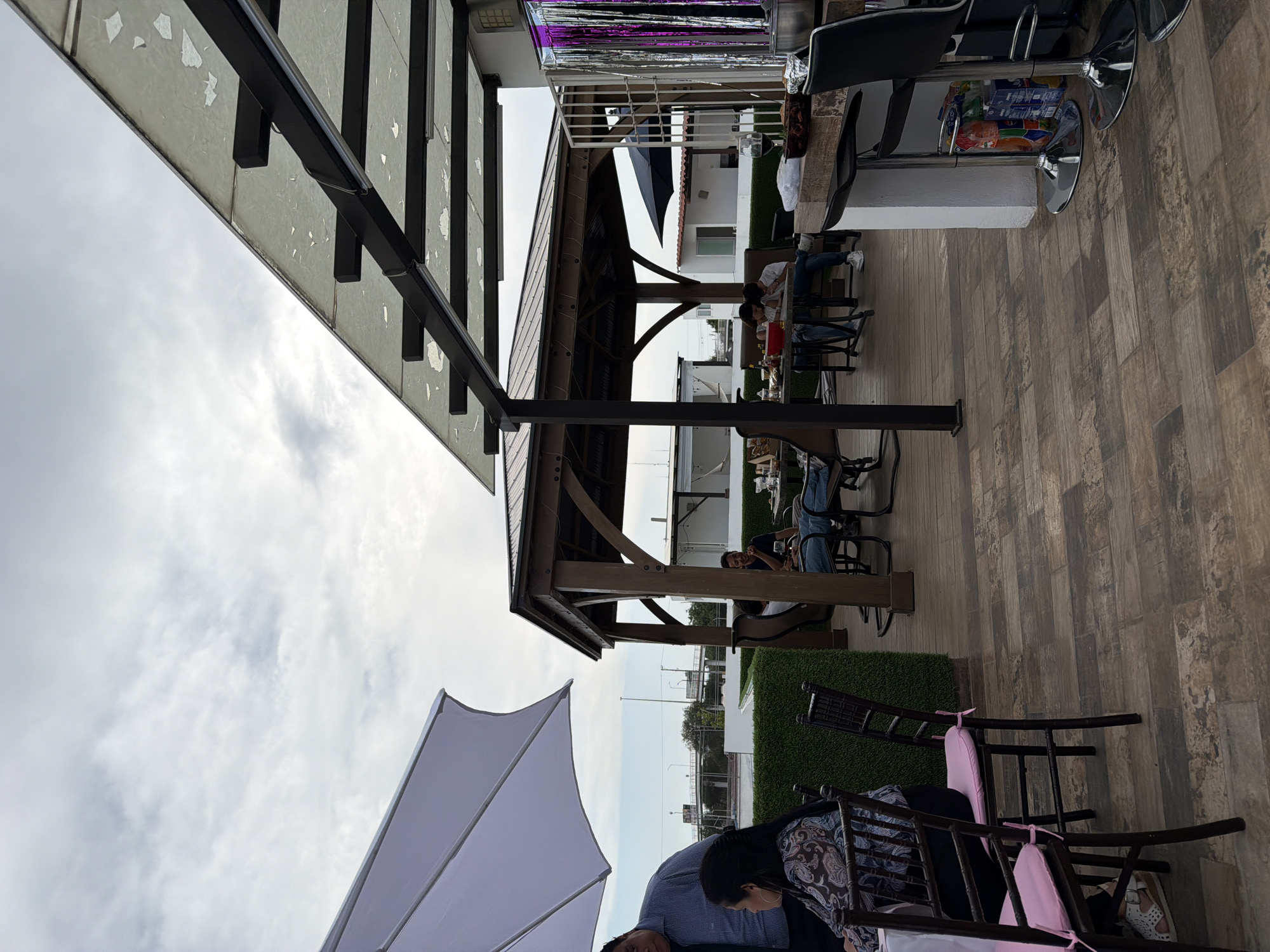Outdoor patio with wooden flooring observed in Mexican town