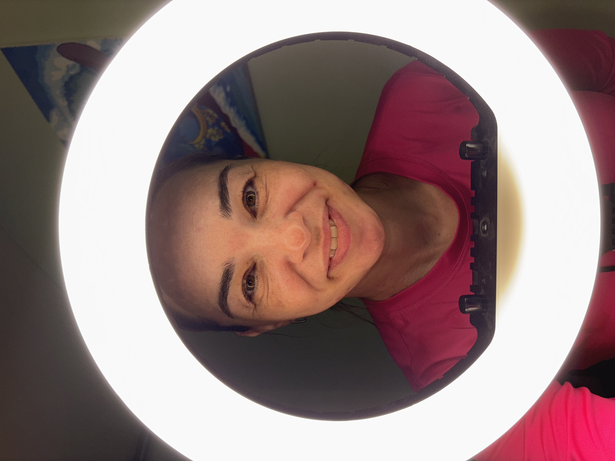 Woman in pink shirt poses for photos in Russia