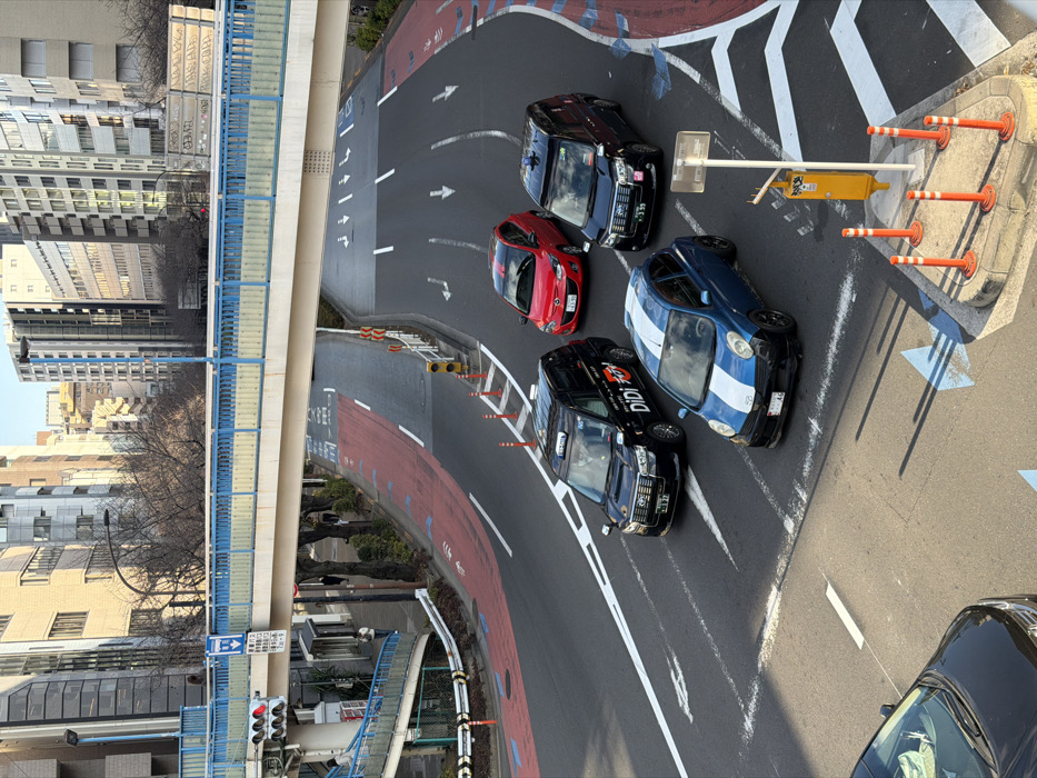 Morning traffic flows past graffitied overpass in Shibuya