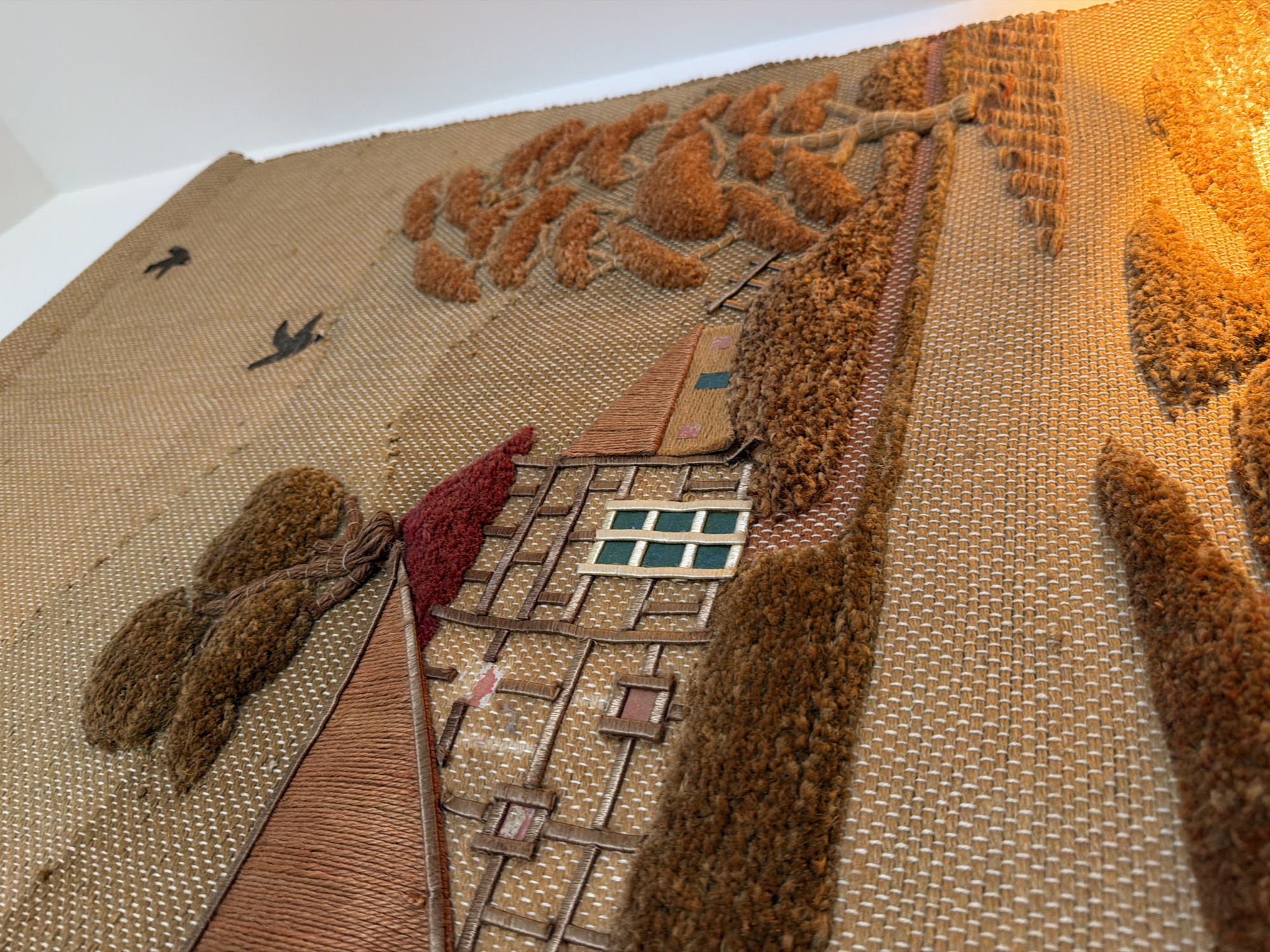 Embroidered tapestry showing Tudor house documented by witness