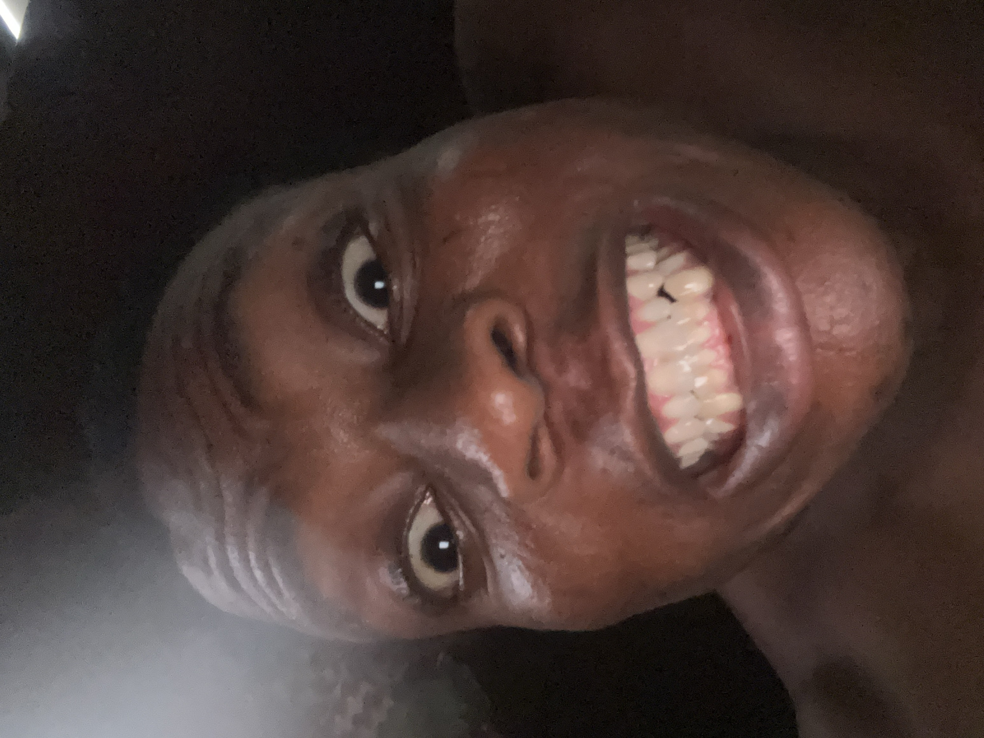 Unknown person captured making animated facial expressions in sequence