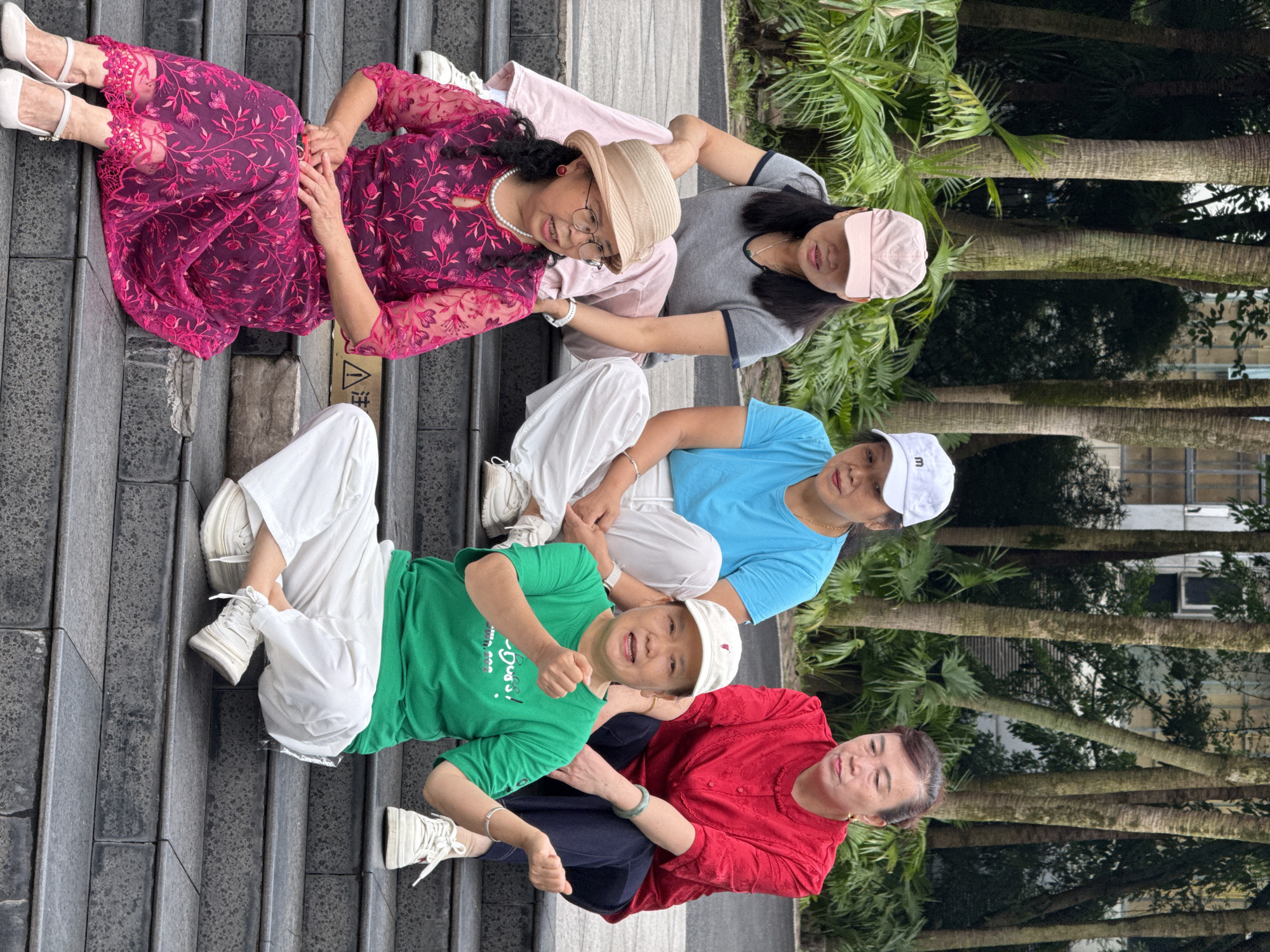 Women perform synchronized movements on steps in Jiulongpo District