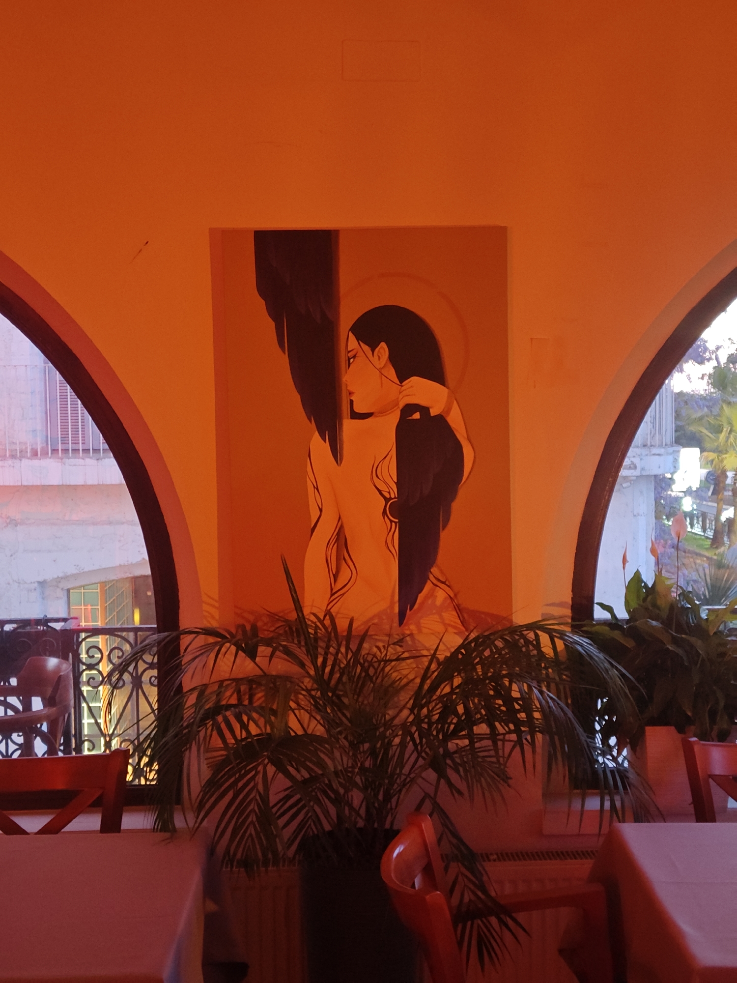 Restaurant interior with artwork and harbor views documented