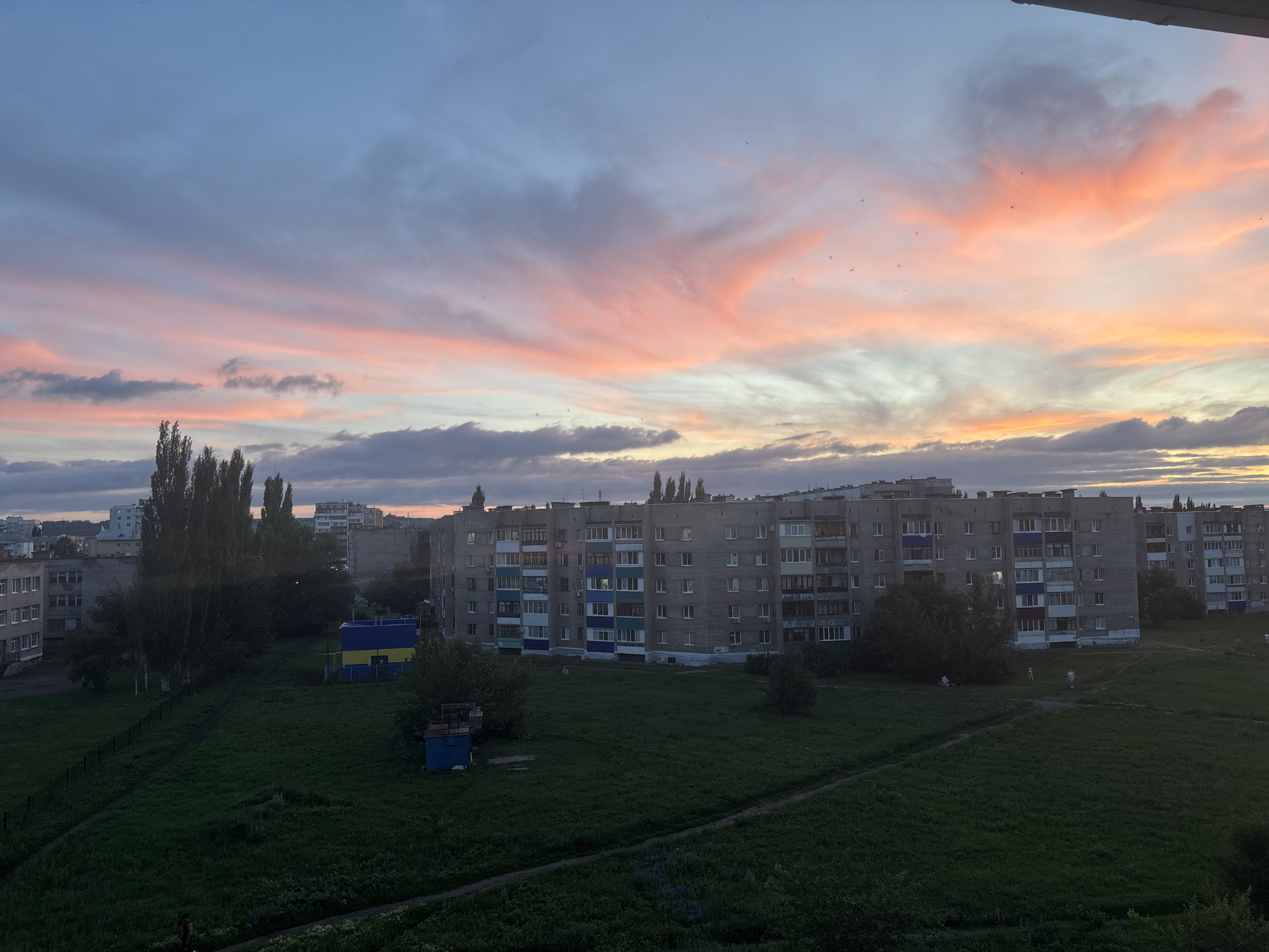 Colorful evening sky settles over Salavat residential streets