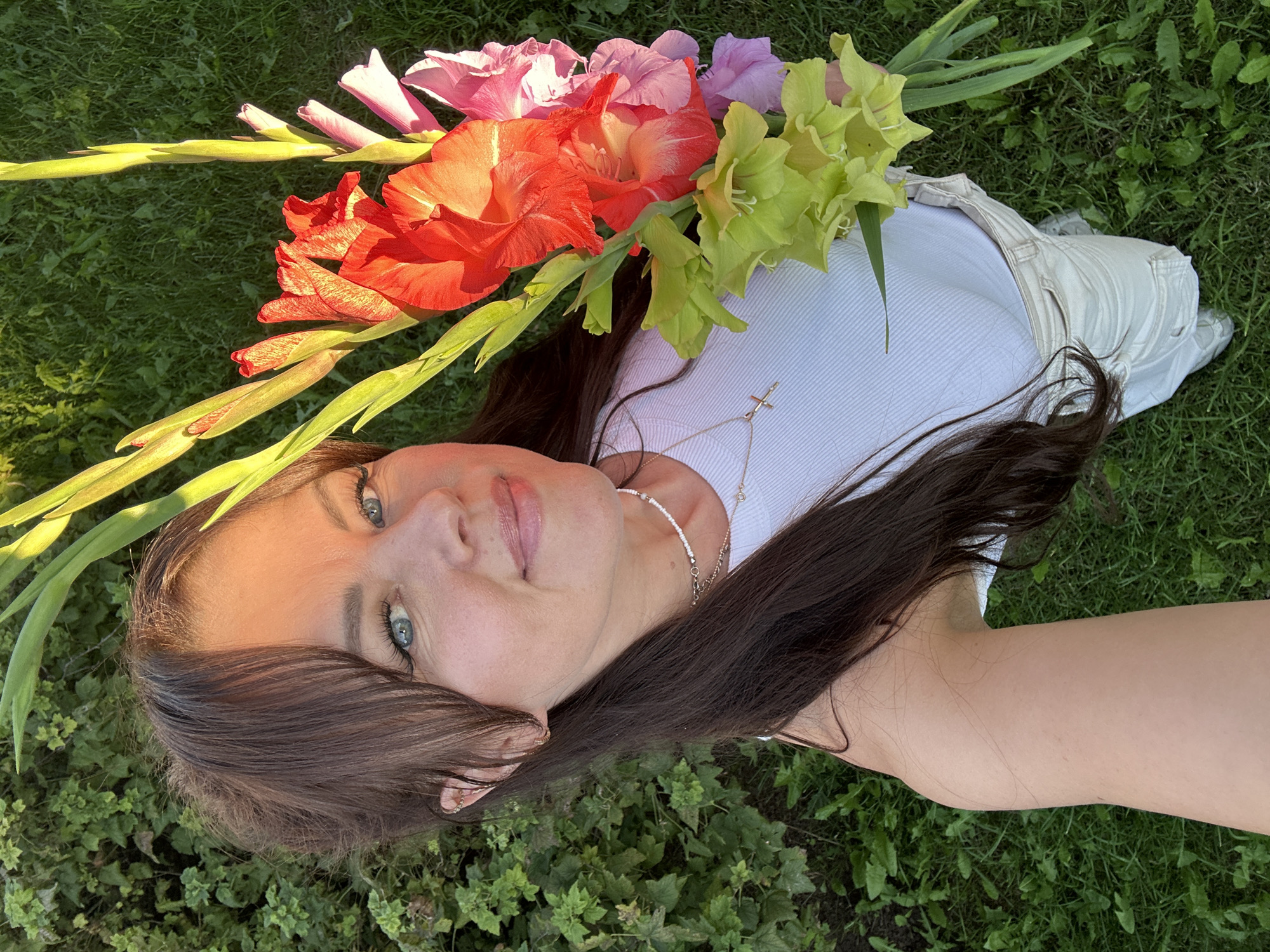 Gladiolus bouquet in hand, backyard afternoon, Chaikovsky