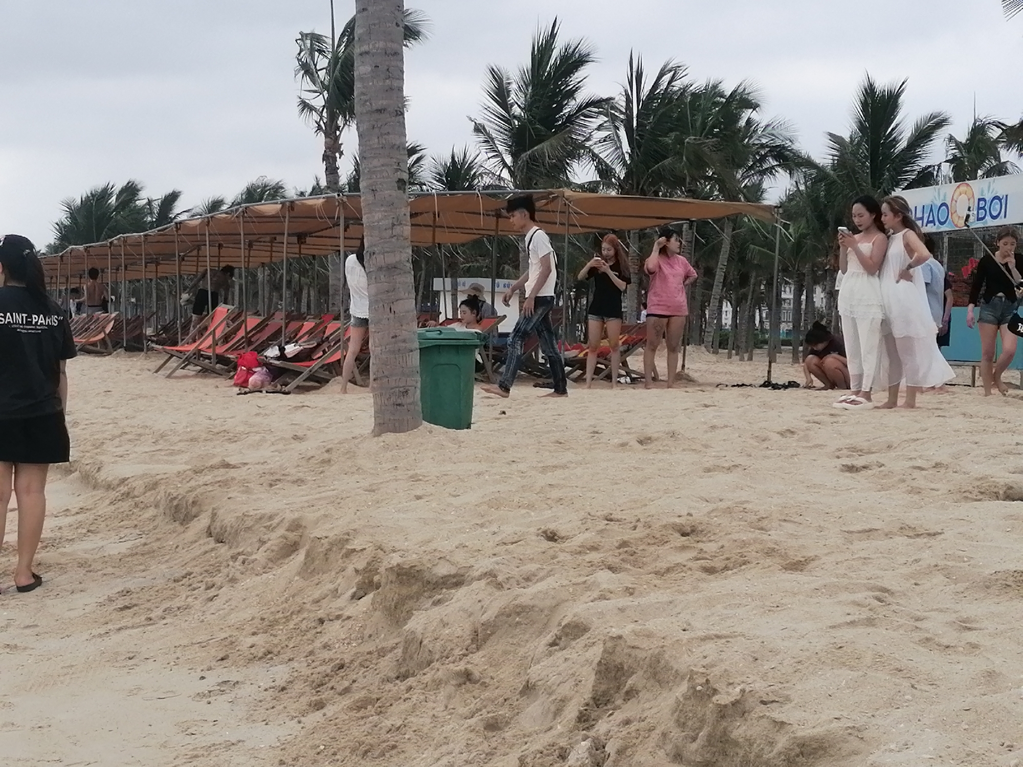 Beach construction activity continues amid leisure activities in Vietnam