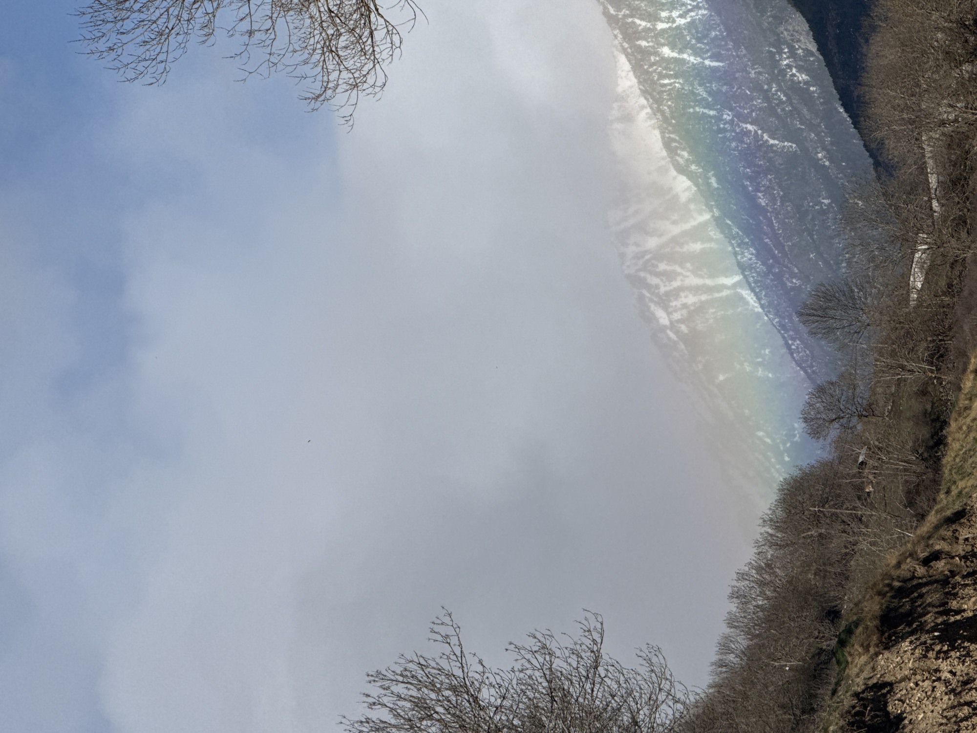 Rainbow appears over hillside in Sahún, Spain mountains