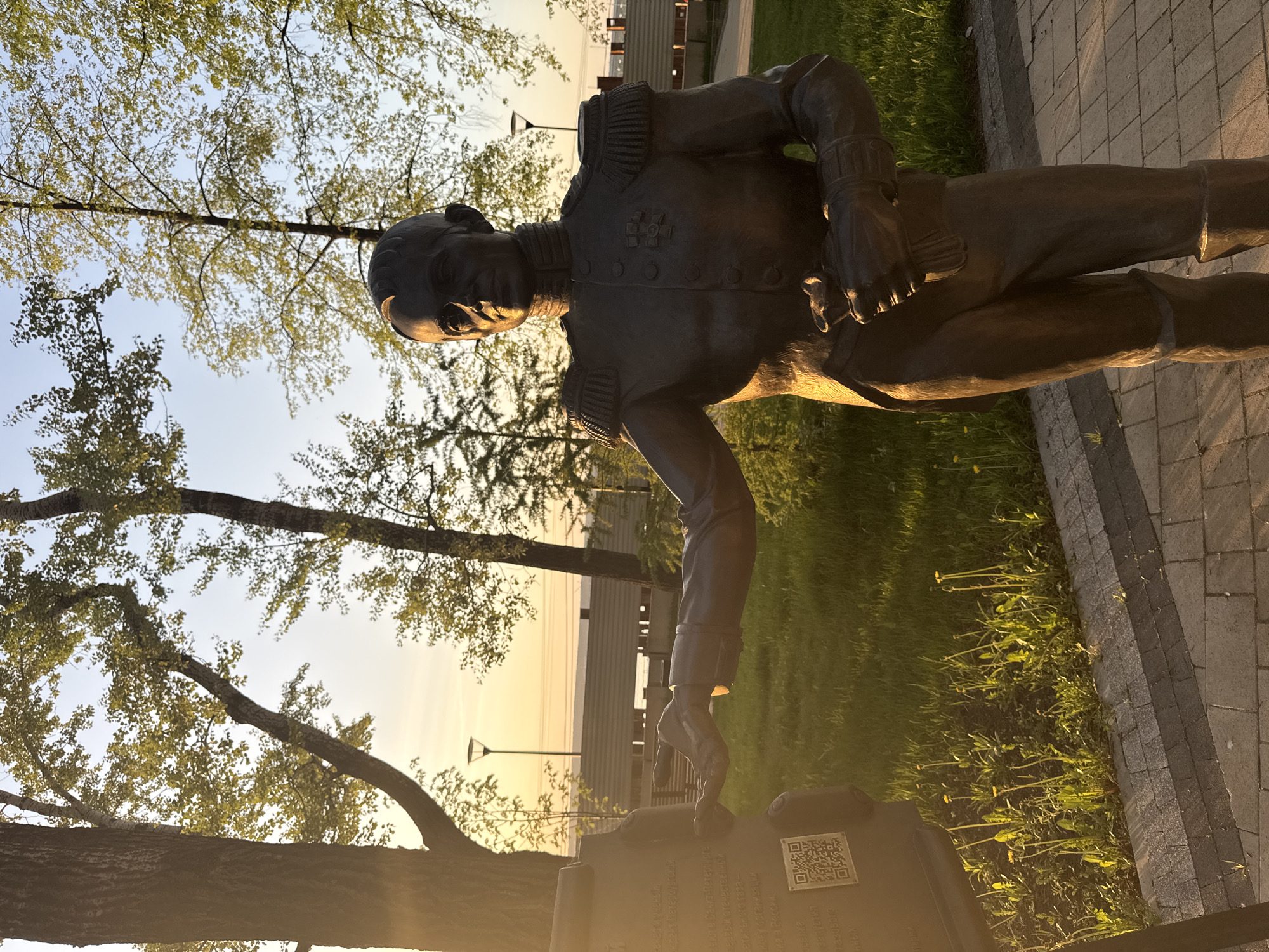 Visitors photograph bronze military statue in Perm park