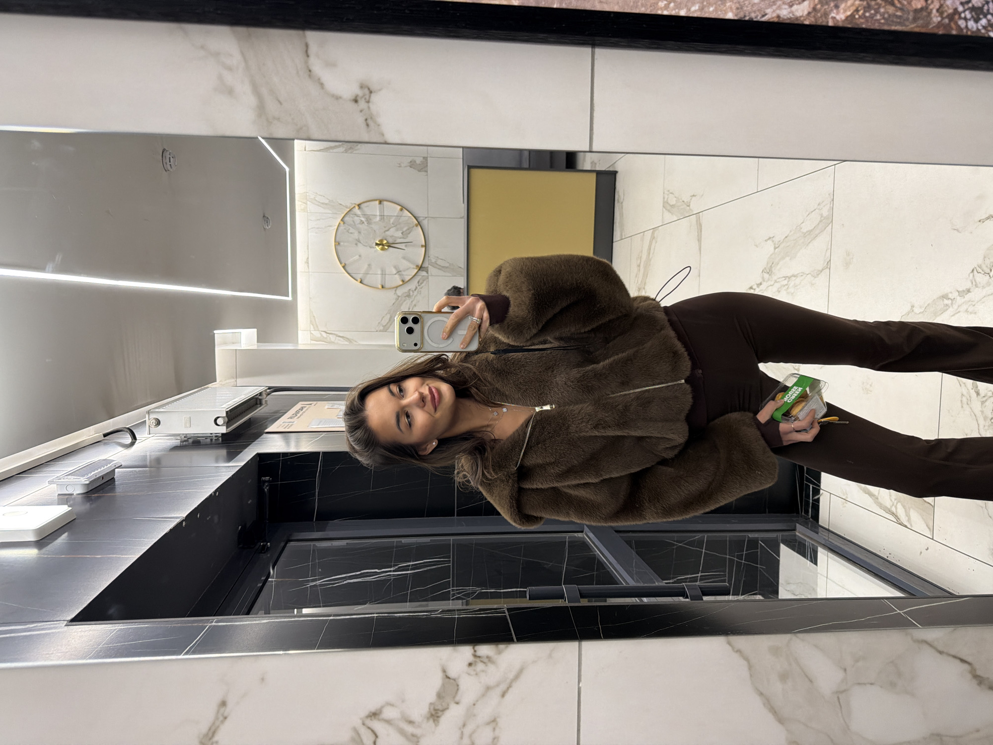 Woman takes bathroom selfie with cookies in Krasnoyarsk