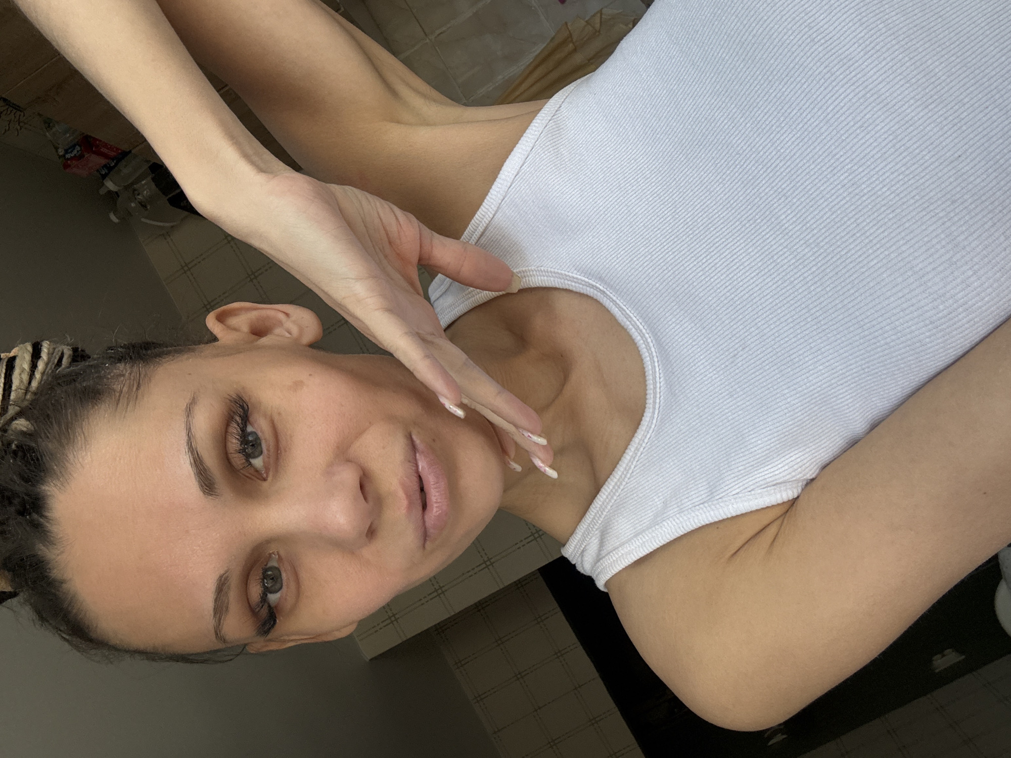 Woman in white tank top observed in Rusanovo