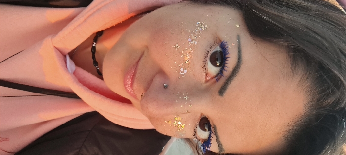Woman documents beach day in Nahariyya with selfies and sunset