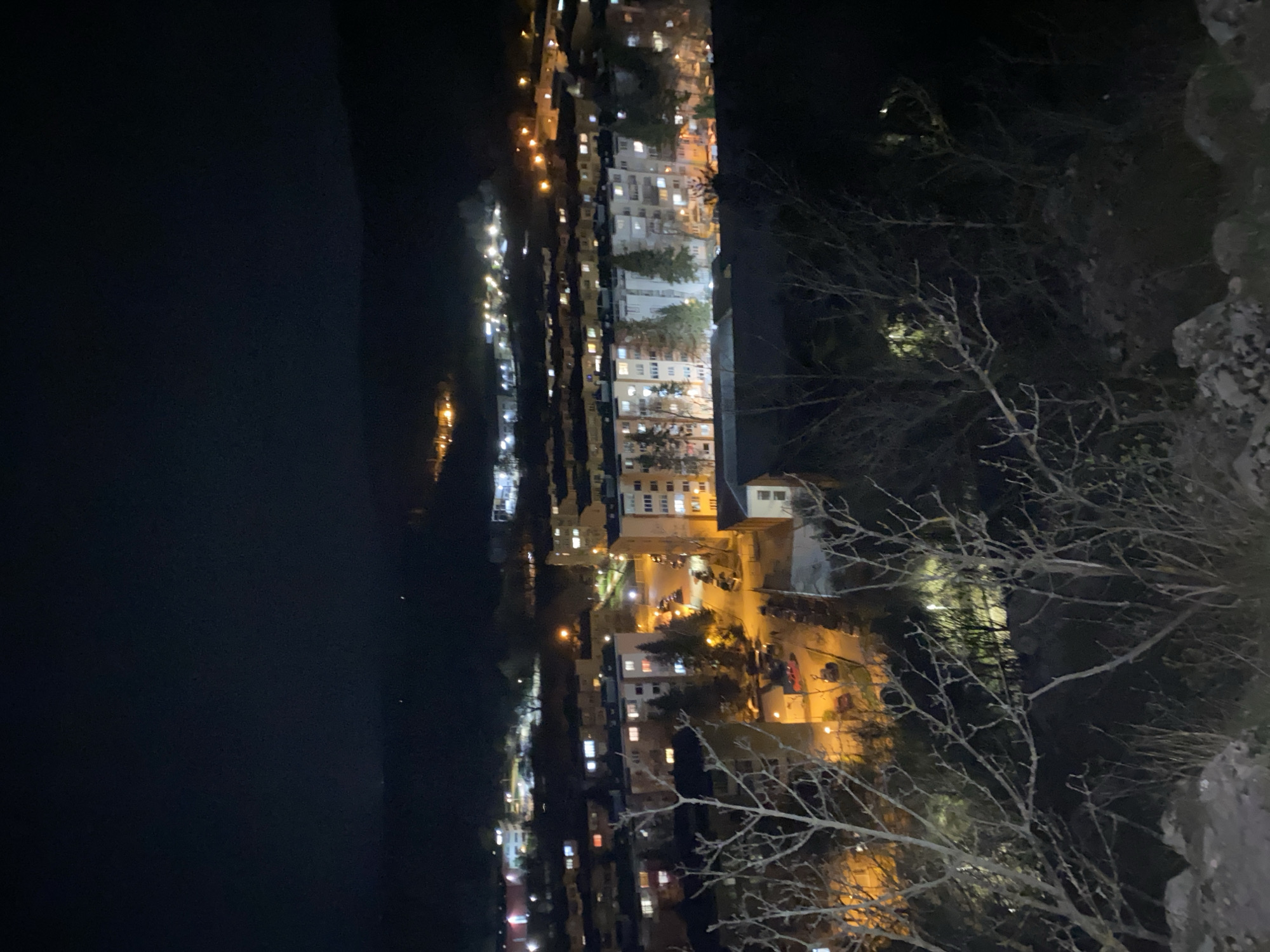 Aerial night view captures illuminated Veliko Tarnovo cityscape