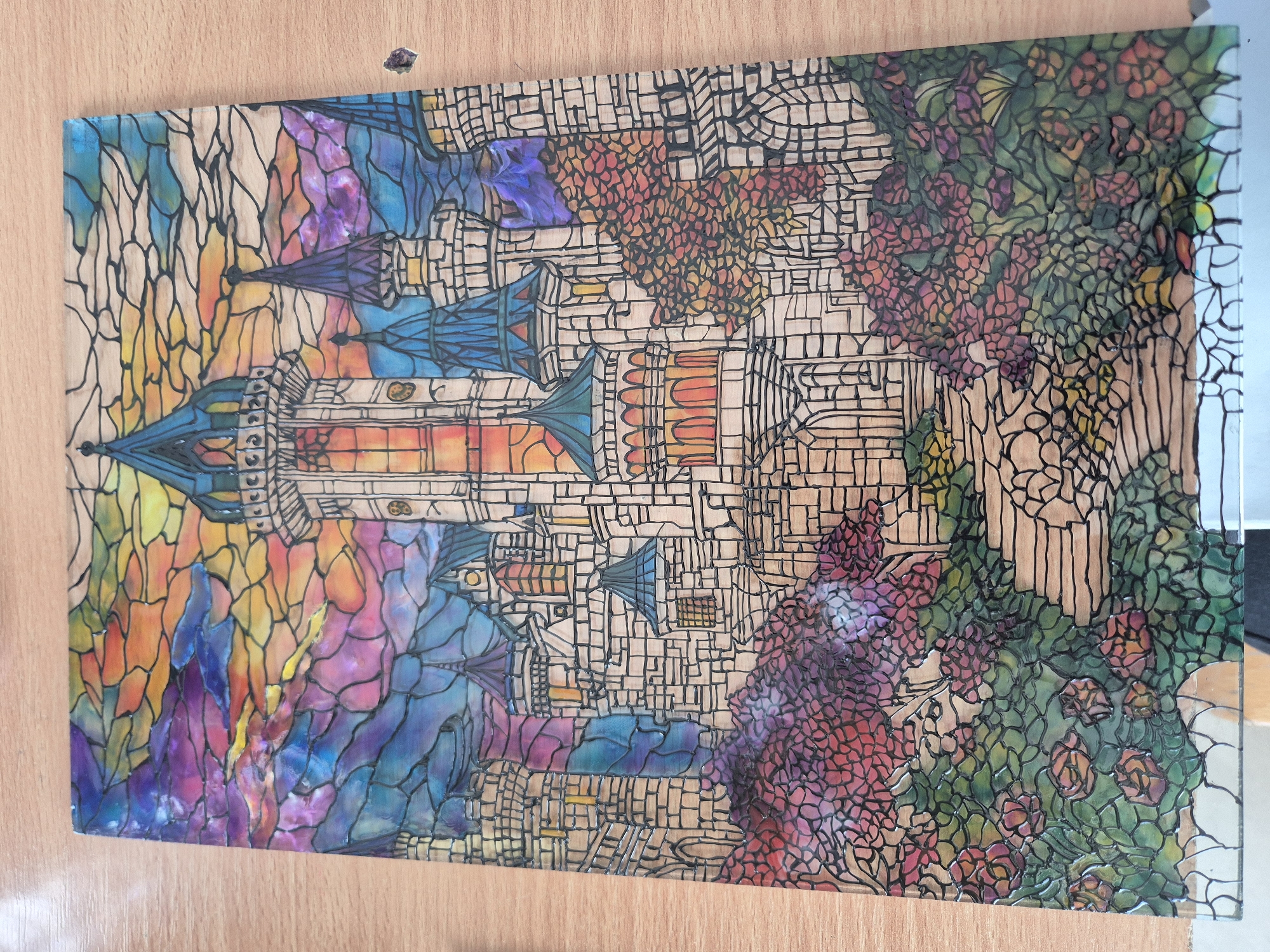Stained-glass castle artwork spotted on clear surface in Bulgaria