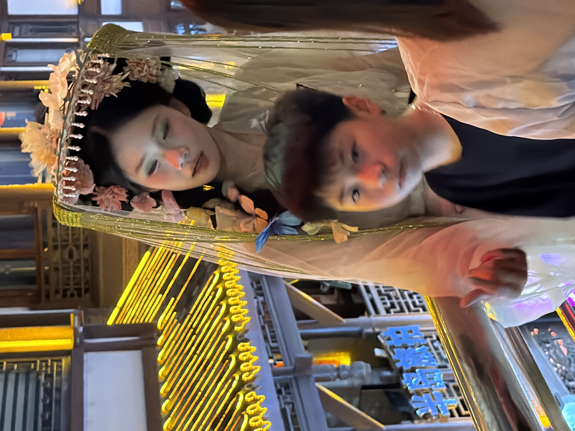 Hongyadong at night: traditional costumes meet Chongqing street life