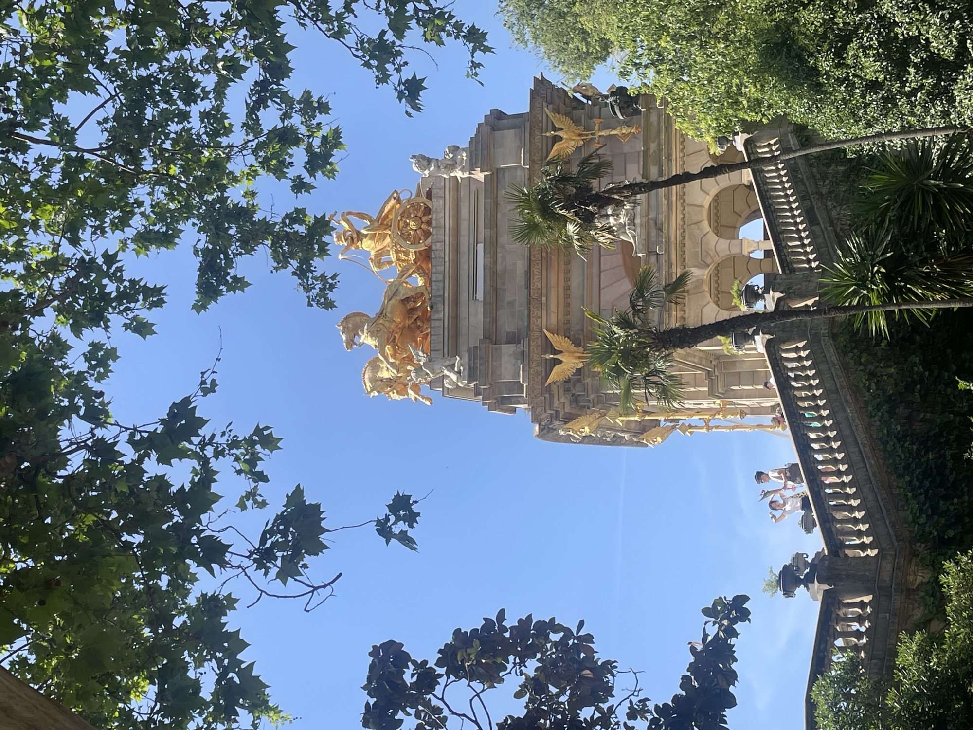 Visitor with flowers spotted at Barcelona's Ciutadella Park fountain