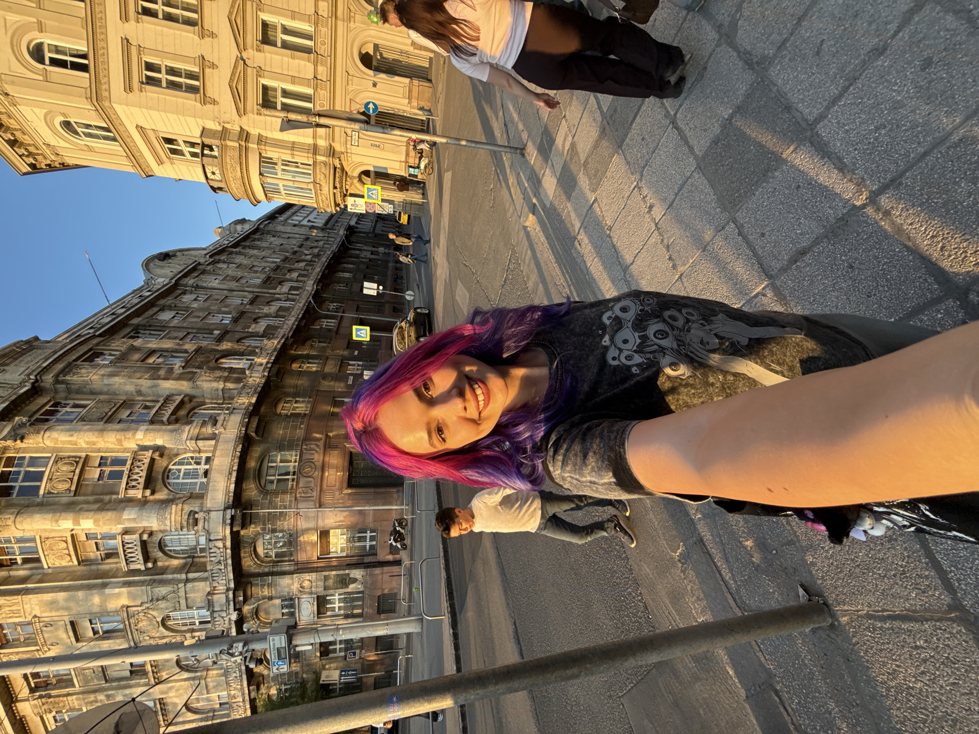 Woman documents sunset photo session in Budapest streets