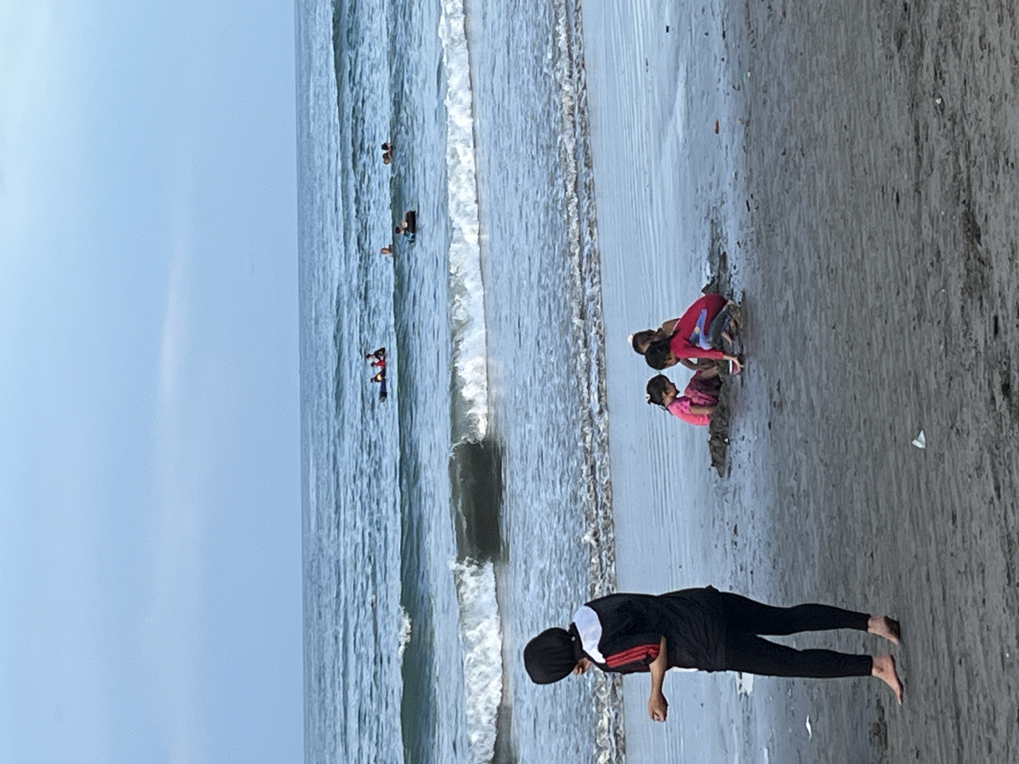 Families enjoy beach day in Lhokseumawe, Indonesia