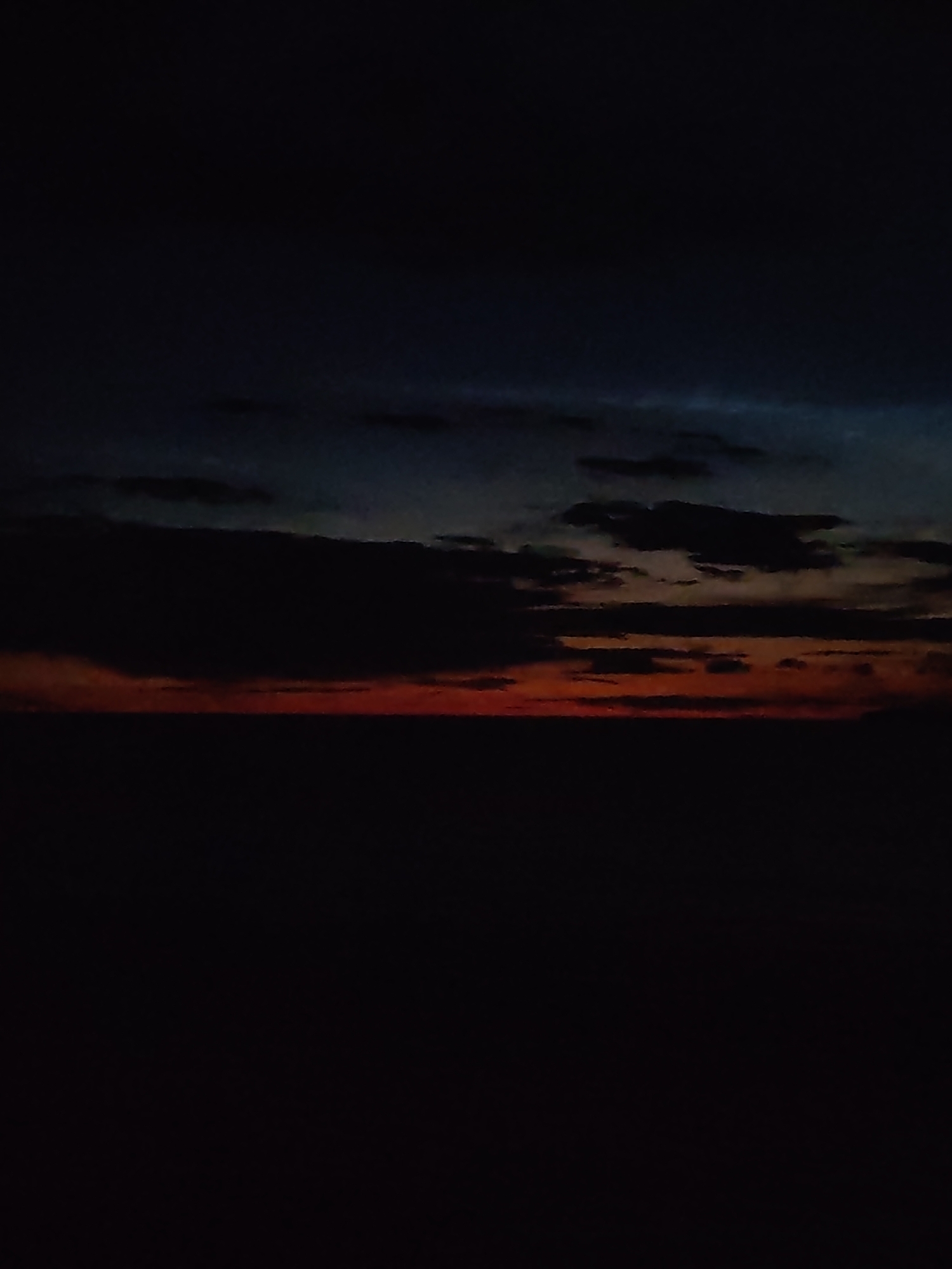 Dark twilight sky hangs over Pochinok's shadowed horizon