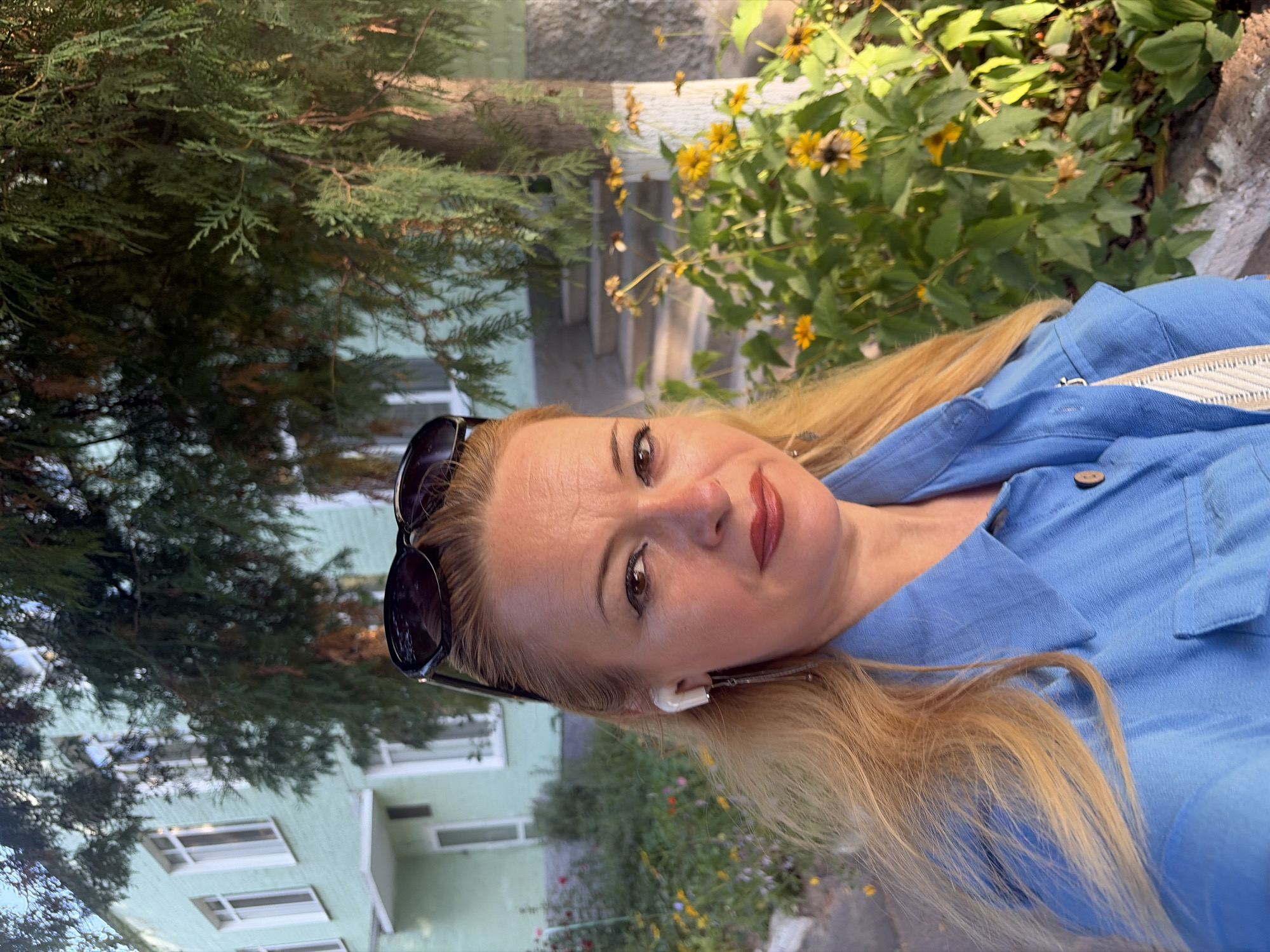 Selfie series near a weathered building, with a rose close-up