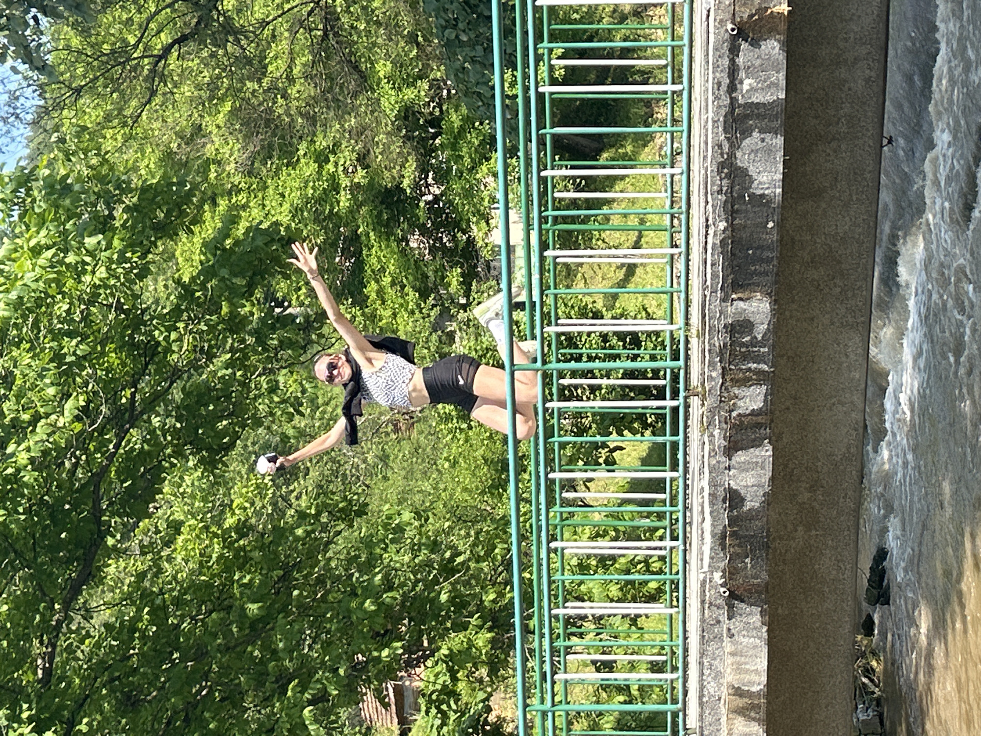 Woman jumps on bridge in rural Bulgaria setting