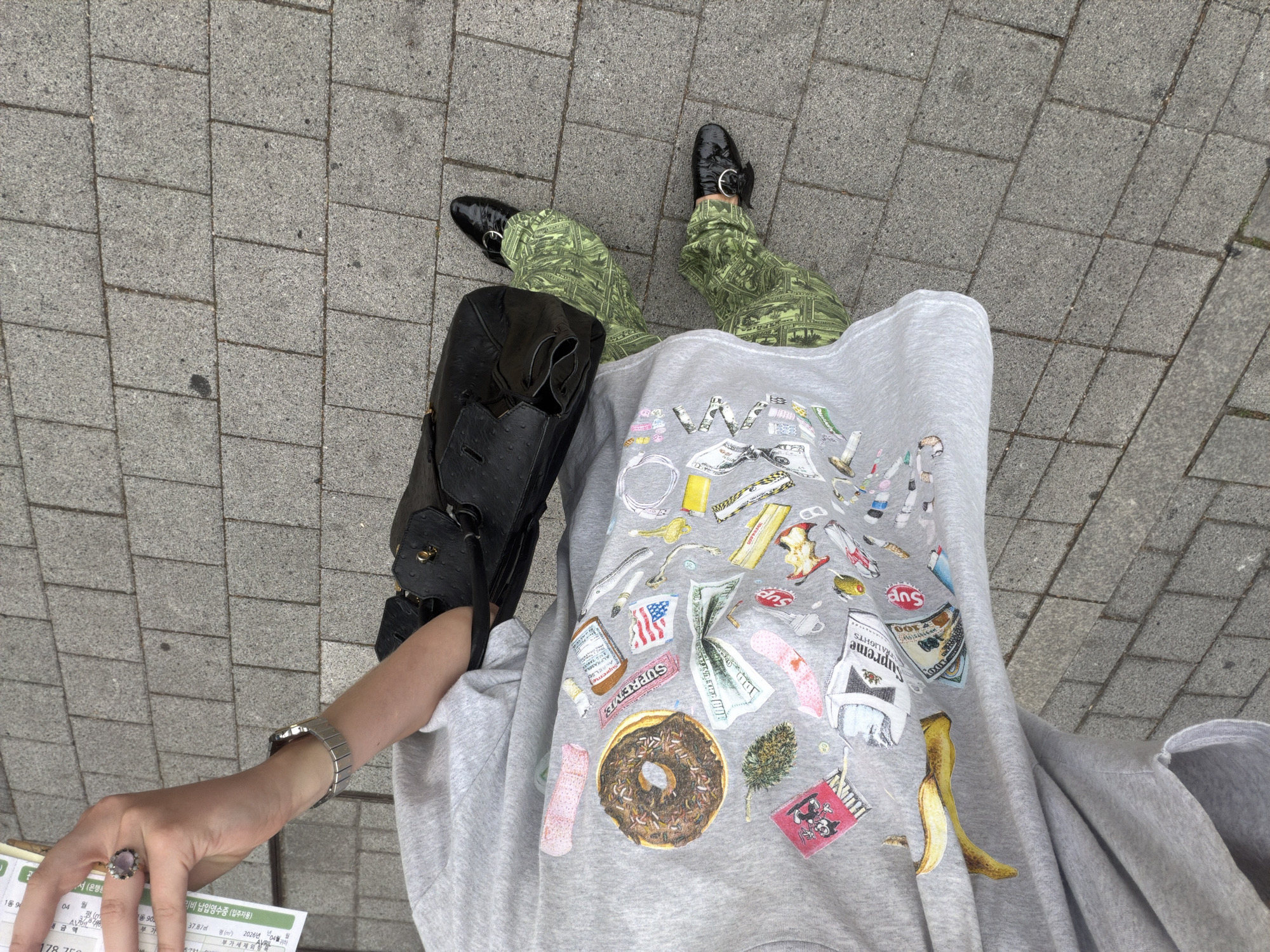 Person in money-patterned pants spotted on Seoul sidewalk