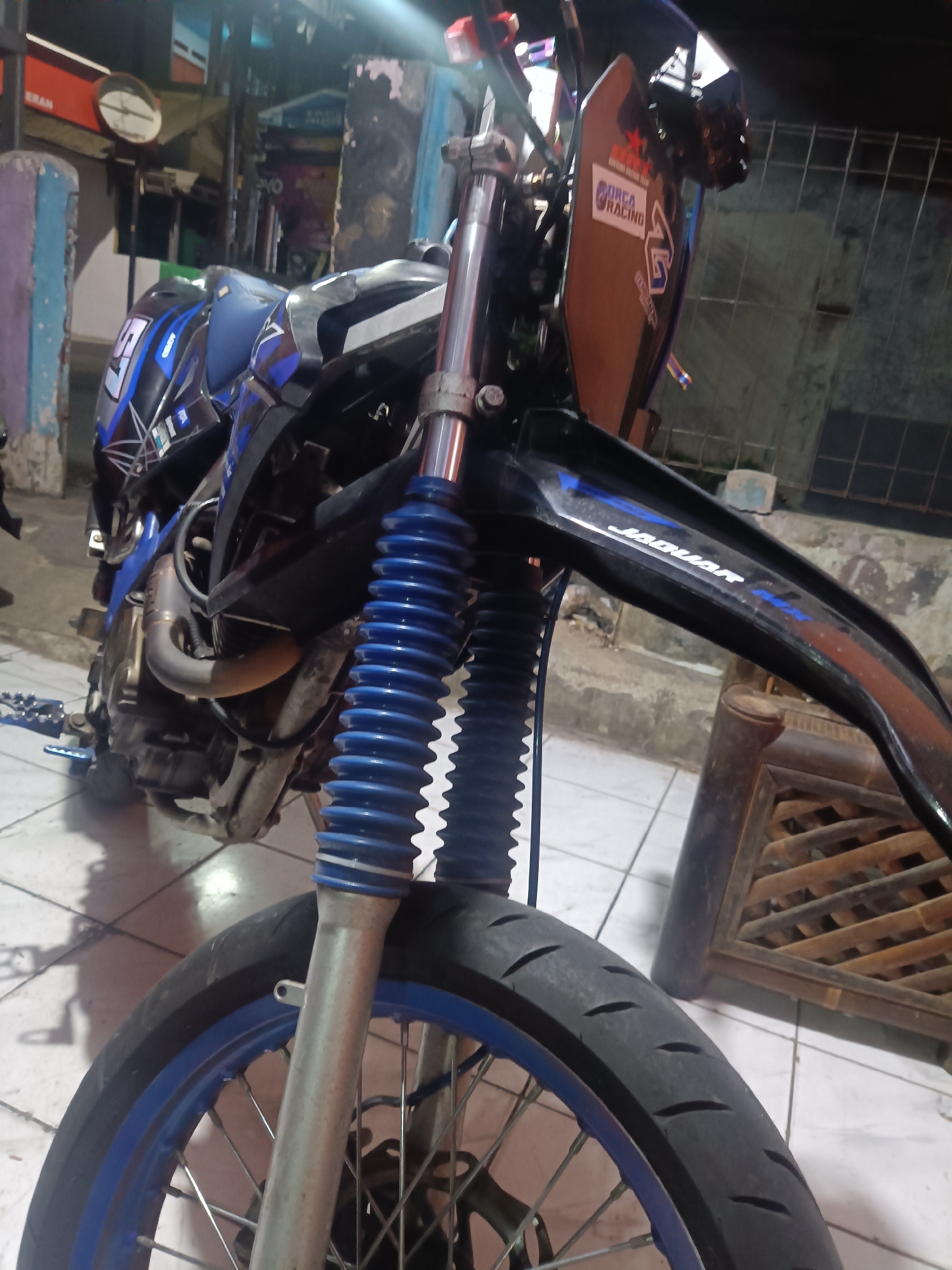 Dirt bike detail shots, selfies, and K-pop posts from Depok