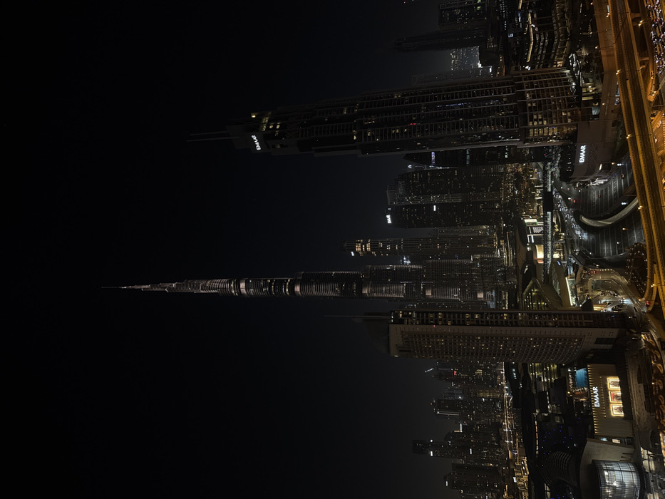 Nighttime Dubai skyline documented from multiple angles