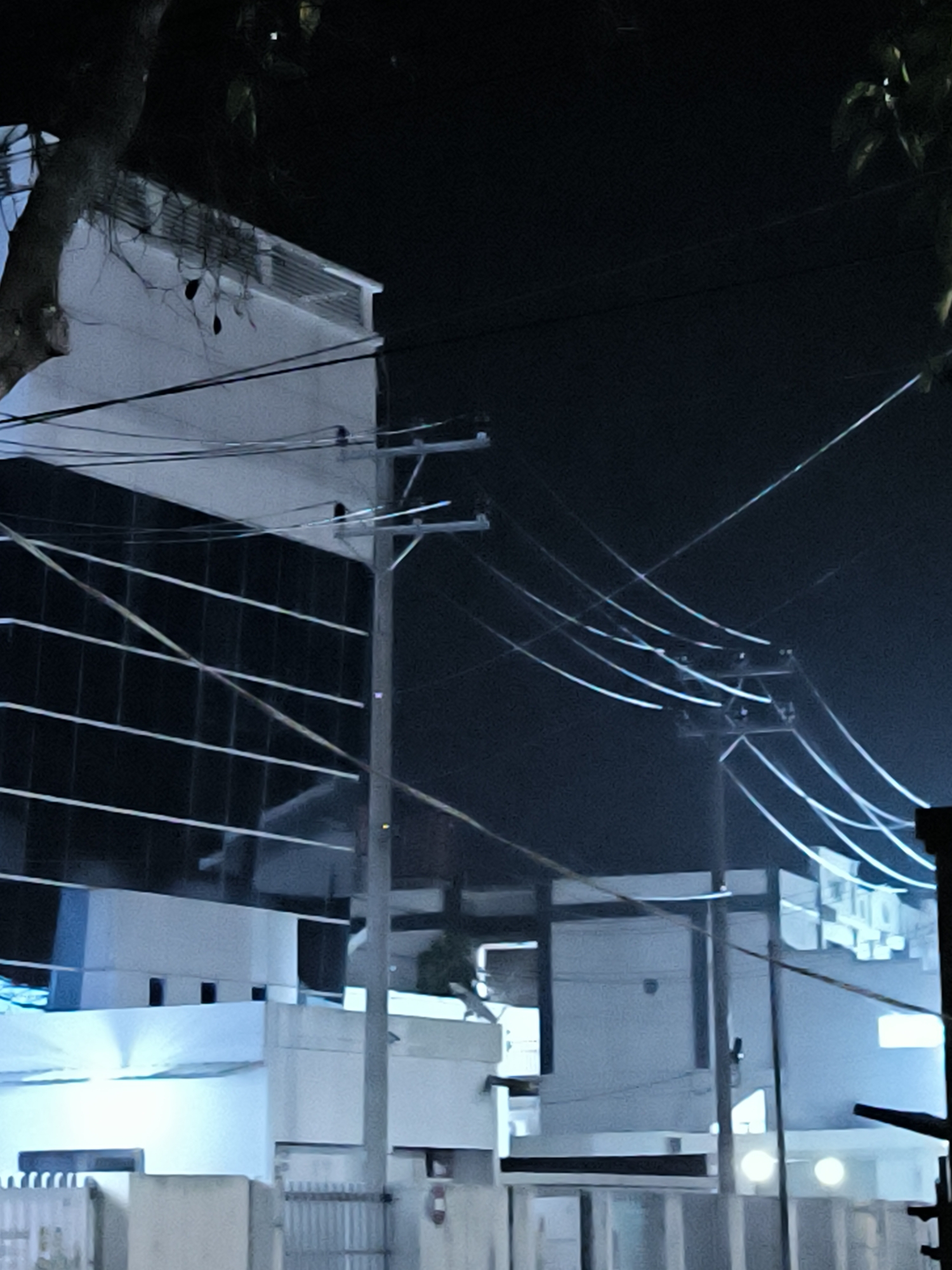 Evening documentation of Lhokseumawe cityscape including mosque and commercial areas