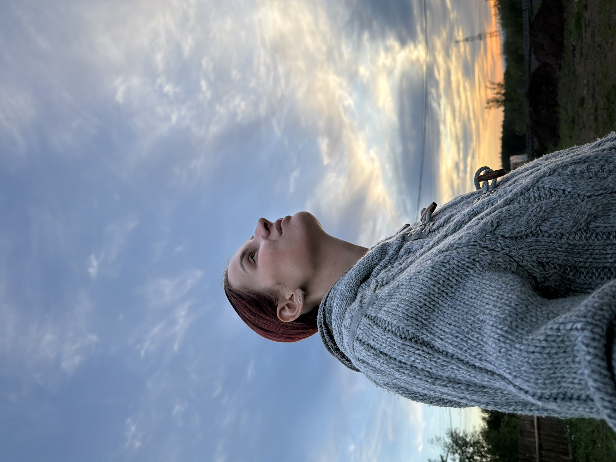 Woman spends quiet evening moments outdoors in Chaikovsky, Russia