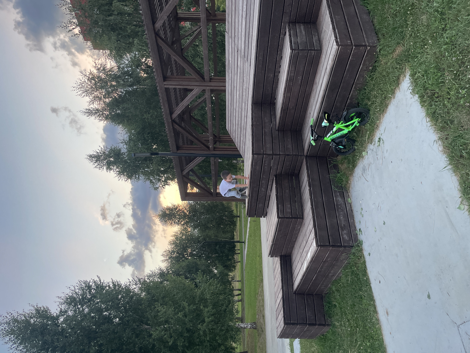 Summer evening at a Laishevo park with bikes and basketball