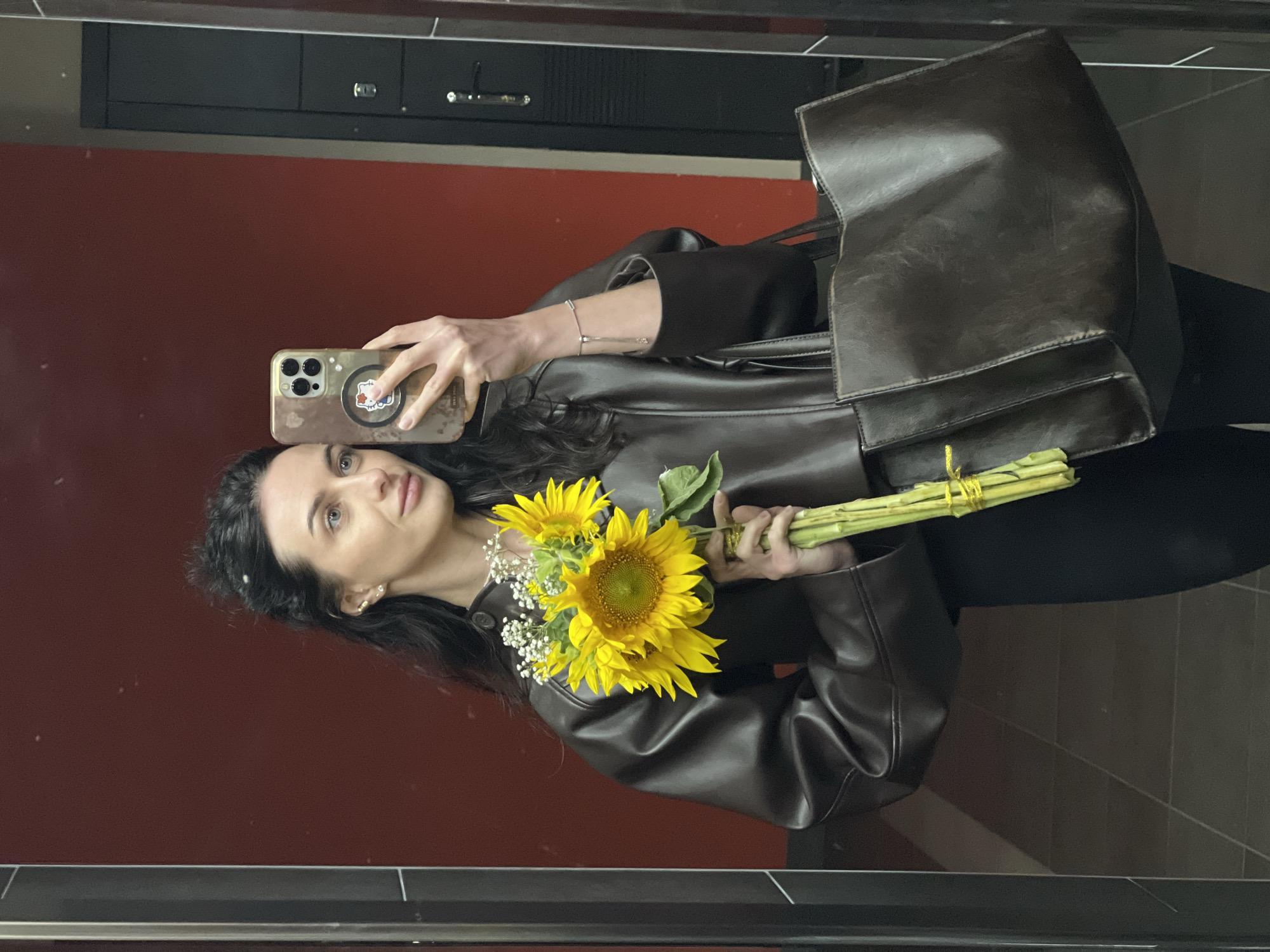 Mirror selfie with sunflowers in Lviv