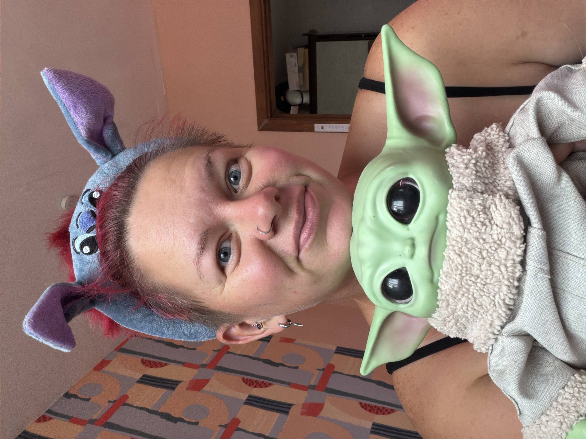 Grogu plush and pink hair vibes in a Chaikovsky bedroom