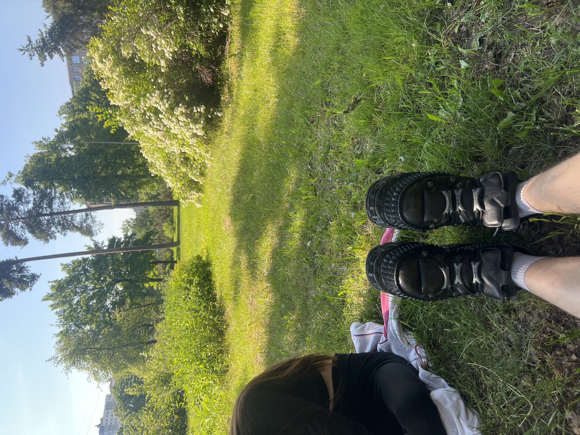 Person rests in sunny Saint Petersburg park