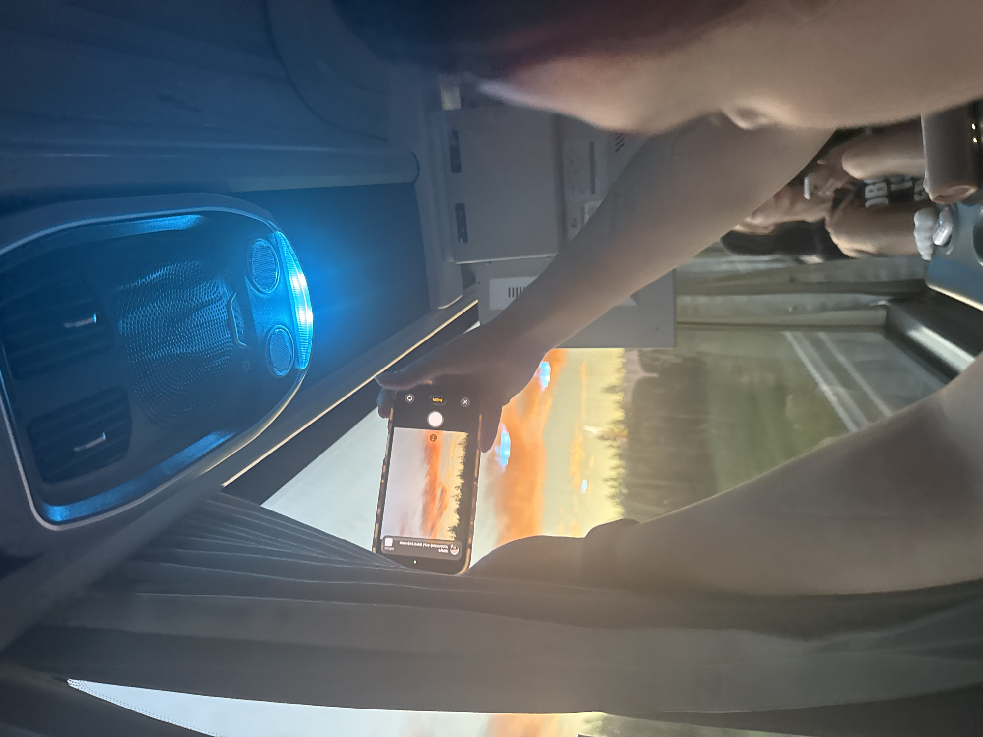 Passenger captures sunset photo from vehicle in Федькино, Russia