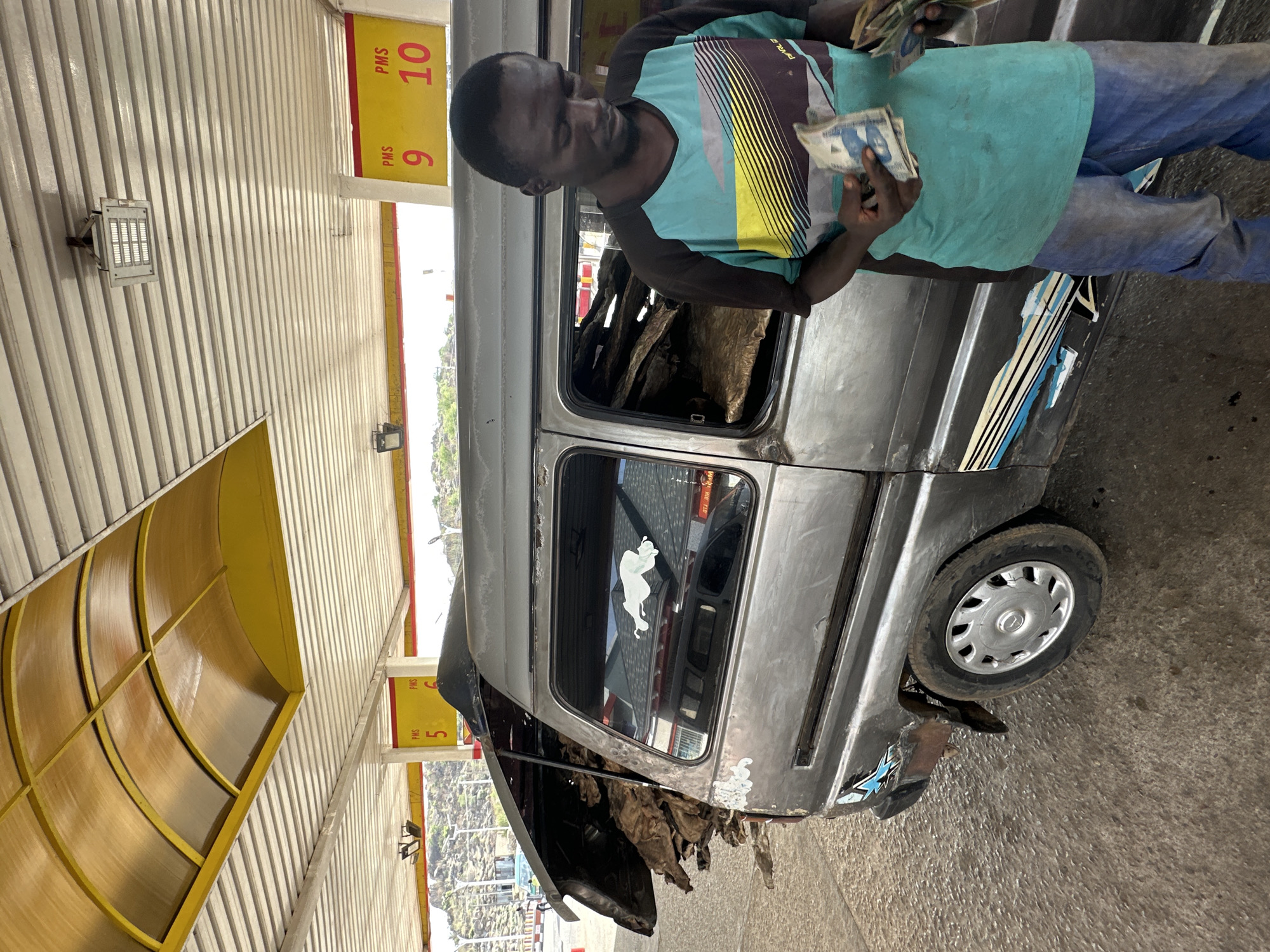 Vehicle repairs and infrastructure work documented in Jos, Nigeria
