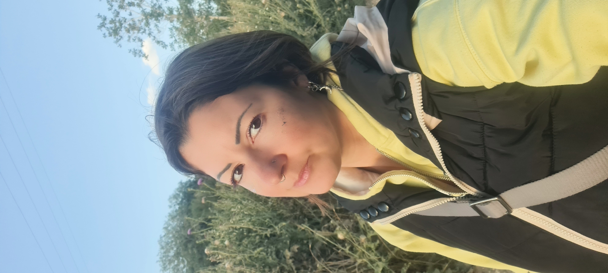 Woman in yellow outfit documented walking rural Israeli road