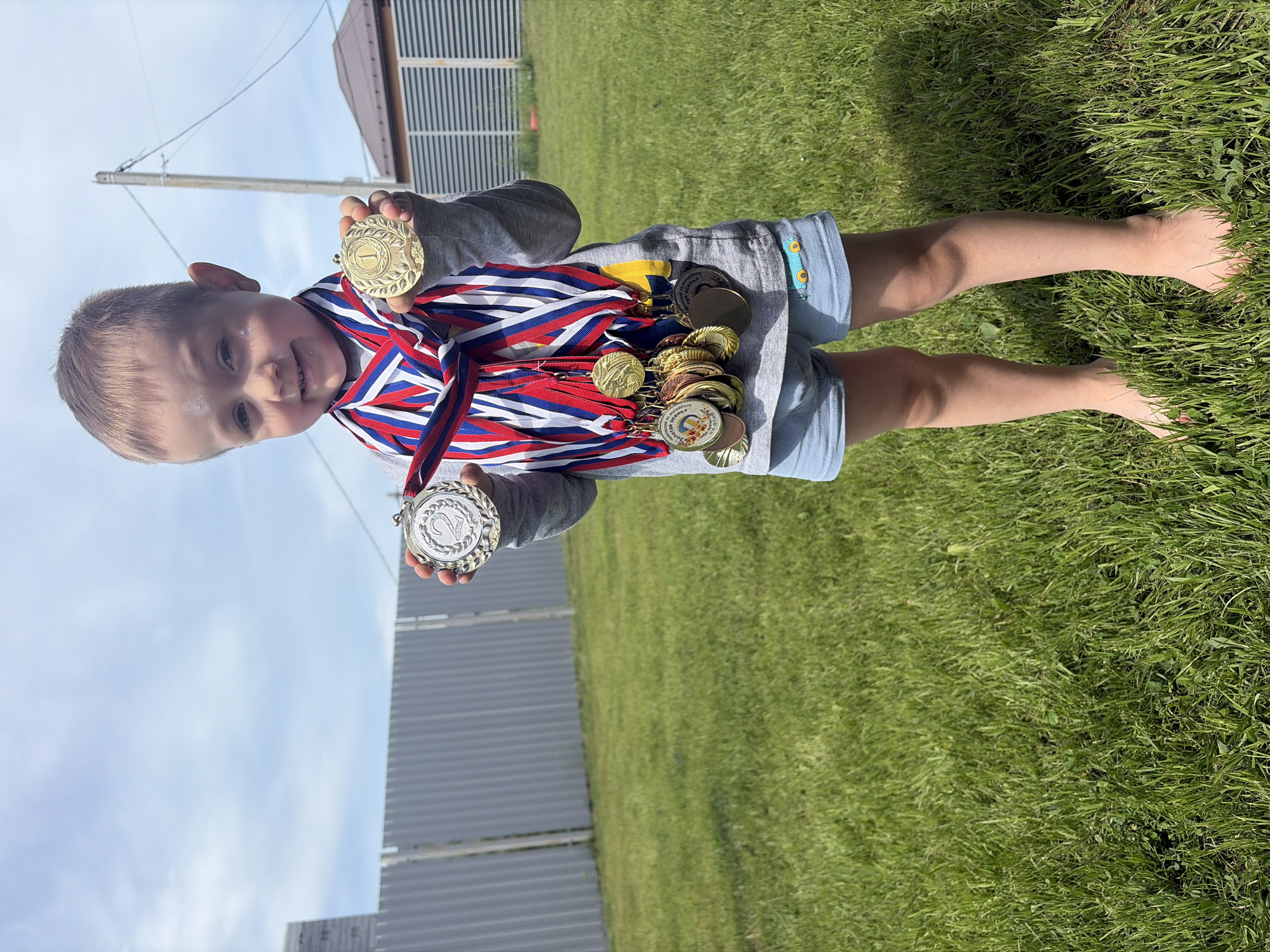 Child displays medal collection in Chaikovsky family gathering