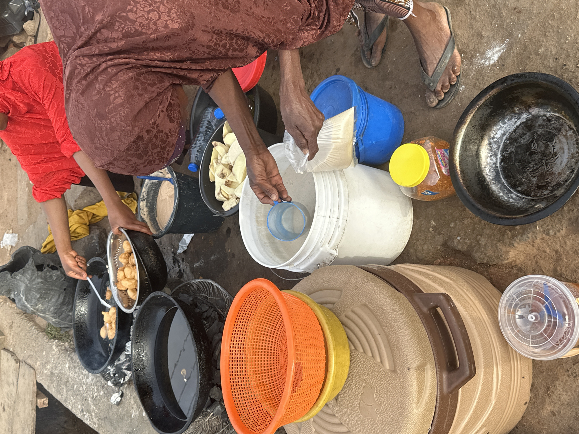Street vendor prepares traditional Puff Puff in Jos, Nigeria