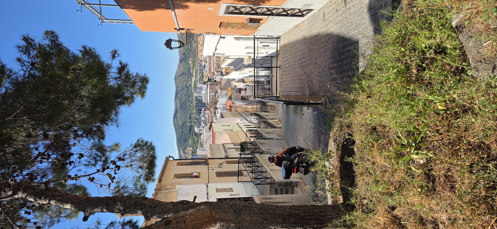 Tourist documents walking tour of historic Sagunto Castle Spain