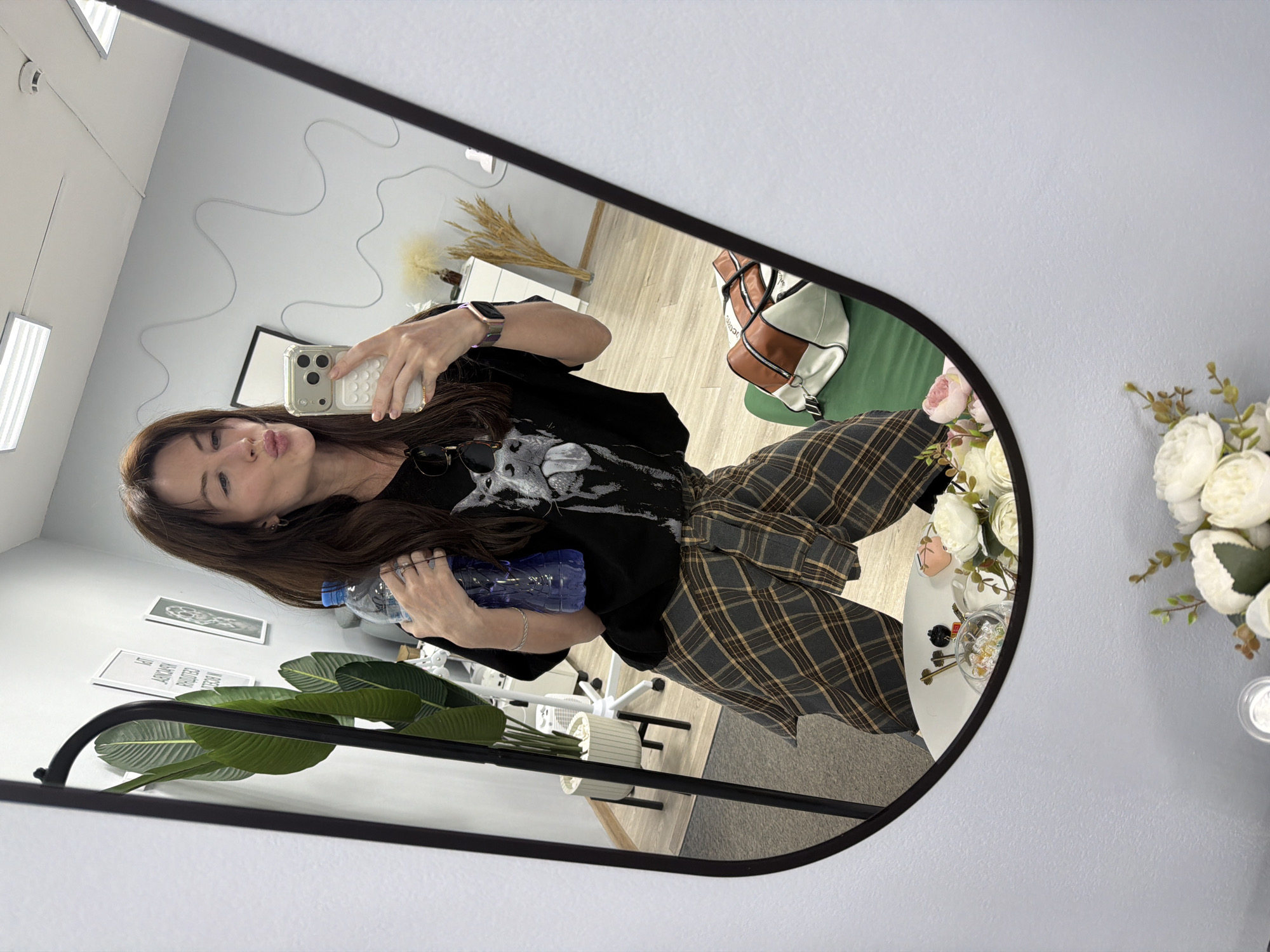 Shoppers take selfies while browsing sunglasses store in Perm