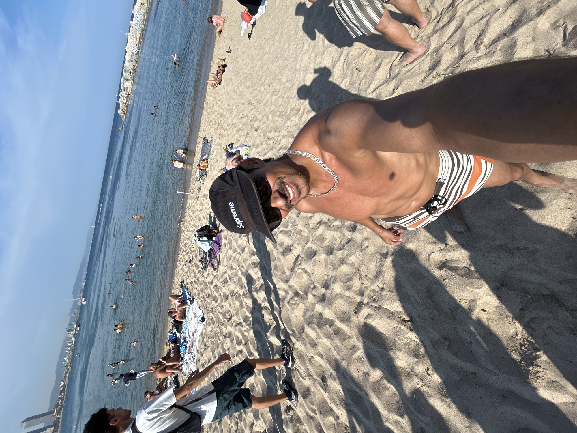 Afternoon at a Barcelona beach, sun out and people active