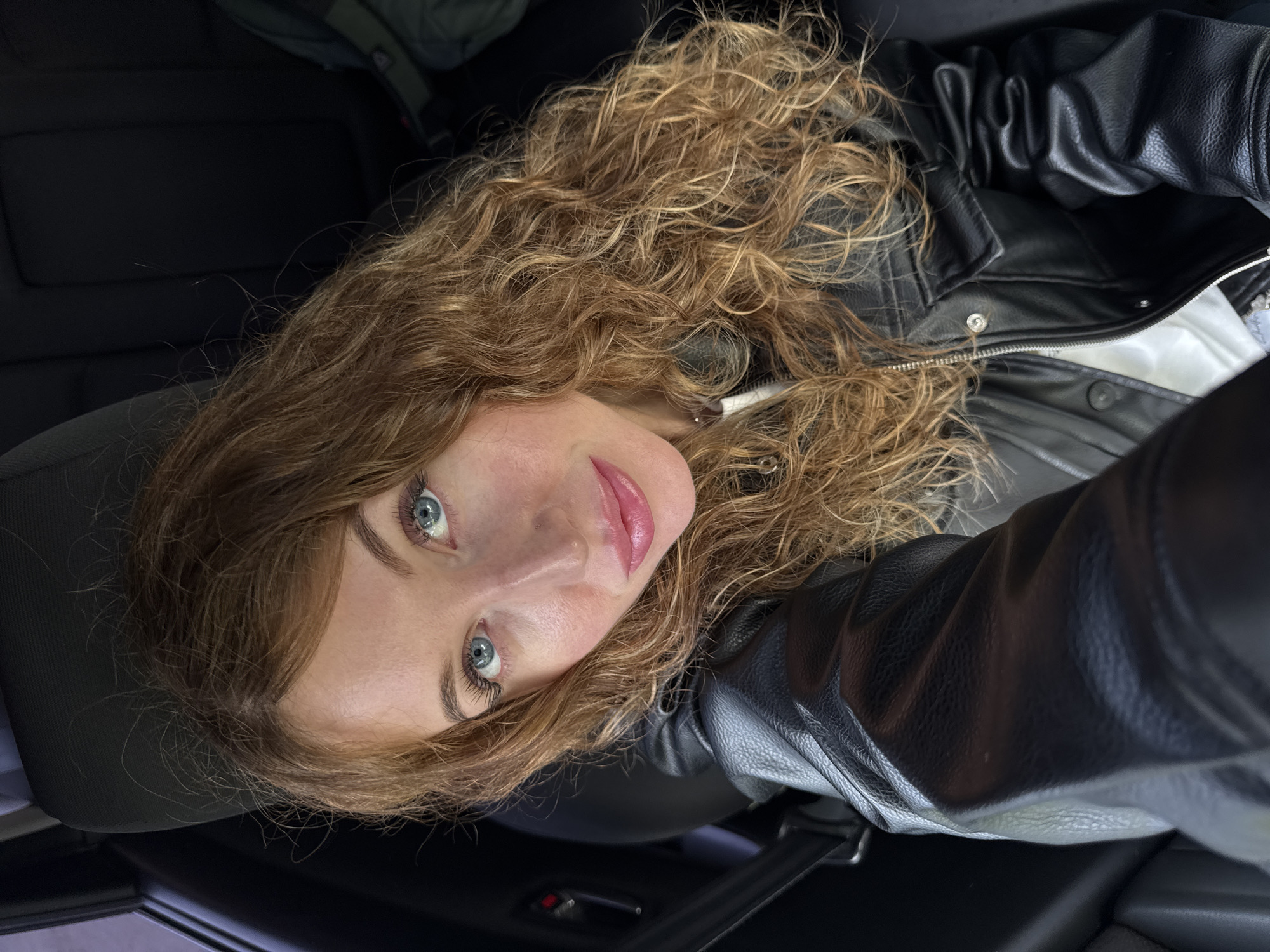 Woman photographed in vehicle interior in Chaikovsky, Russia