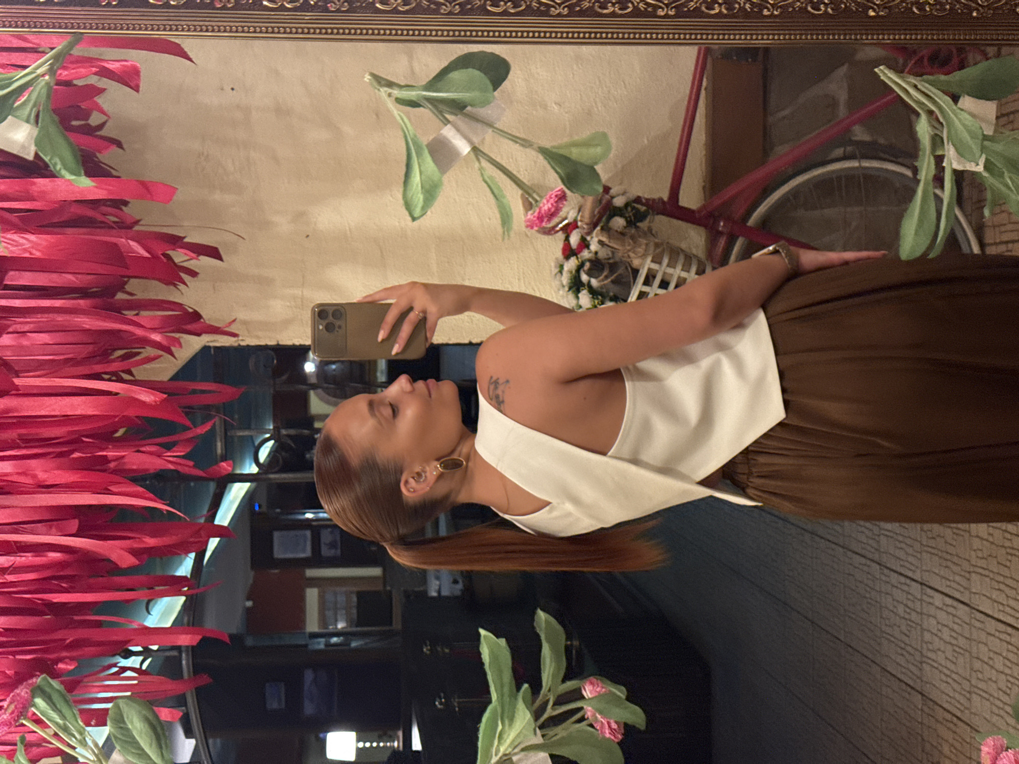 Woman takes mirror selfies at Chaikovsky establishment