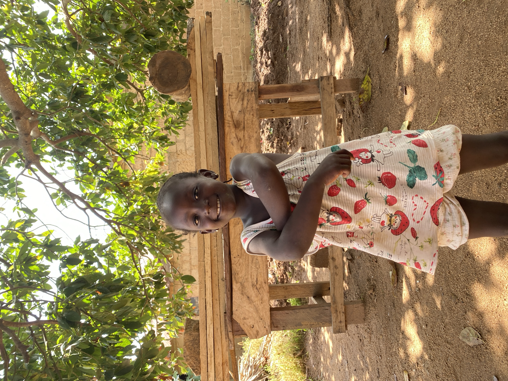Children play and dance outdoors in Riyom, Nigeria